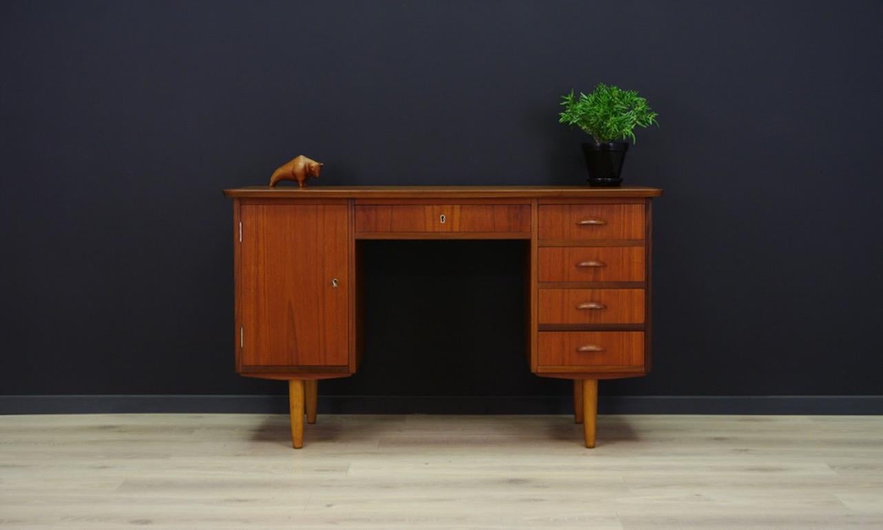 Original 1960s-1970s desk, Danish design, minimalist form finished with teak veneer. Practical front with six drawers. Has a key. Preserved in good condition (small dings and scratches), directly for use.

Dimensions: Height 74.5 cm, tabletop 124