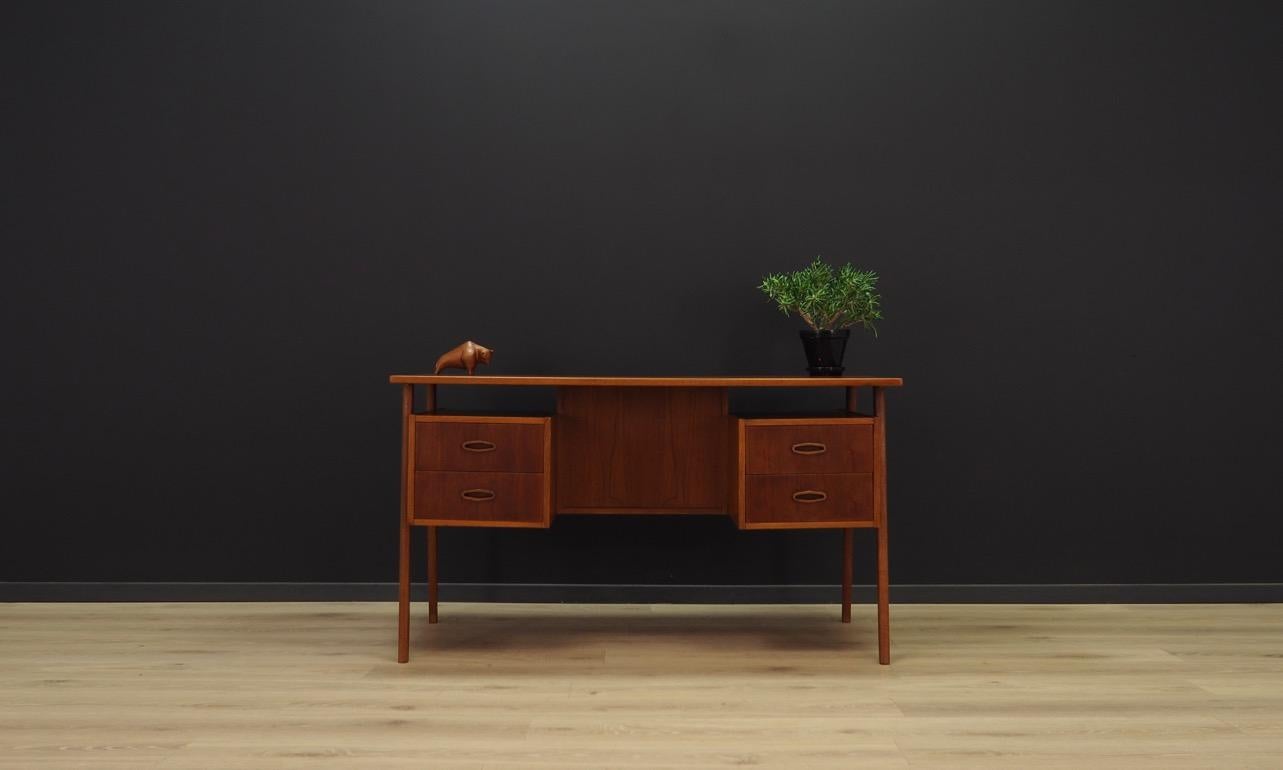 Splendid writing desk from the 1960s-1970s, Minimalist form, Danish design. Furniture veneered with teak. The desk has four drawers in front. The back of the bar and two bookshelves. The key in the set. Preserved in good condition (small bruises and