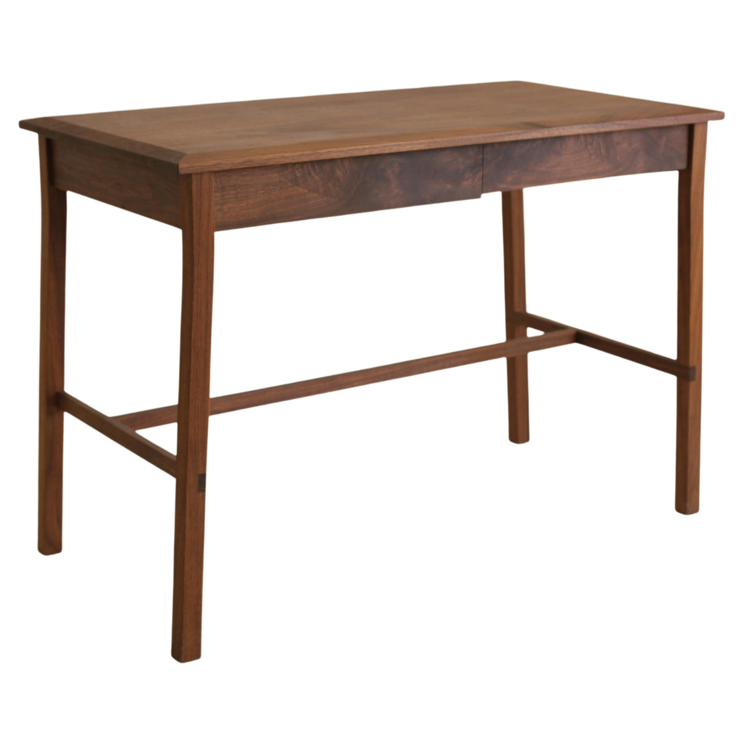 This writing desk in solid walnut was originally made as a gift for my daughter on her 13th birthday. I designed it to be elegant, simple and timeless; something that could fit seamlessly into her various homes as she moves through life. The