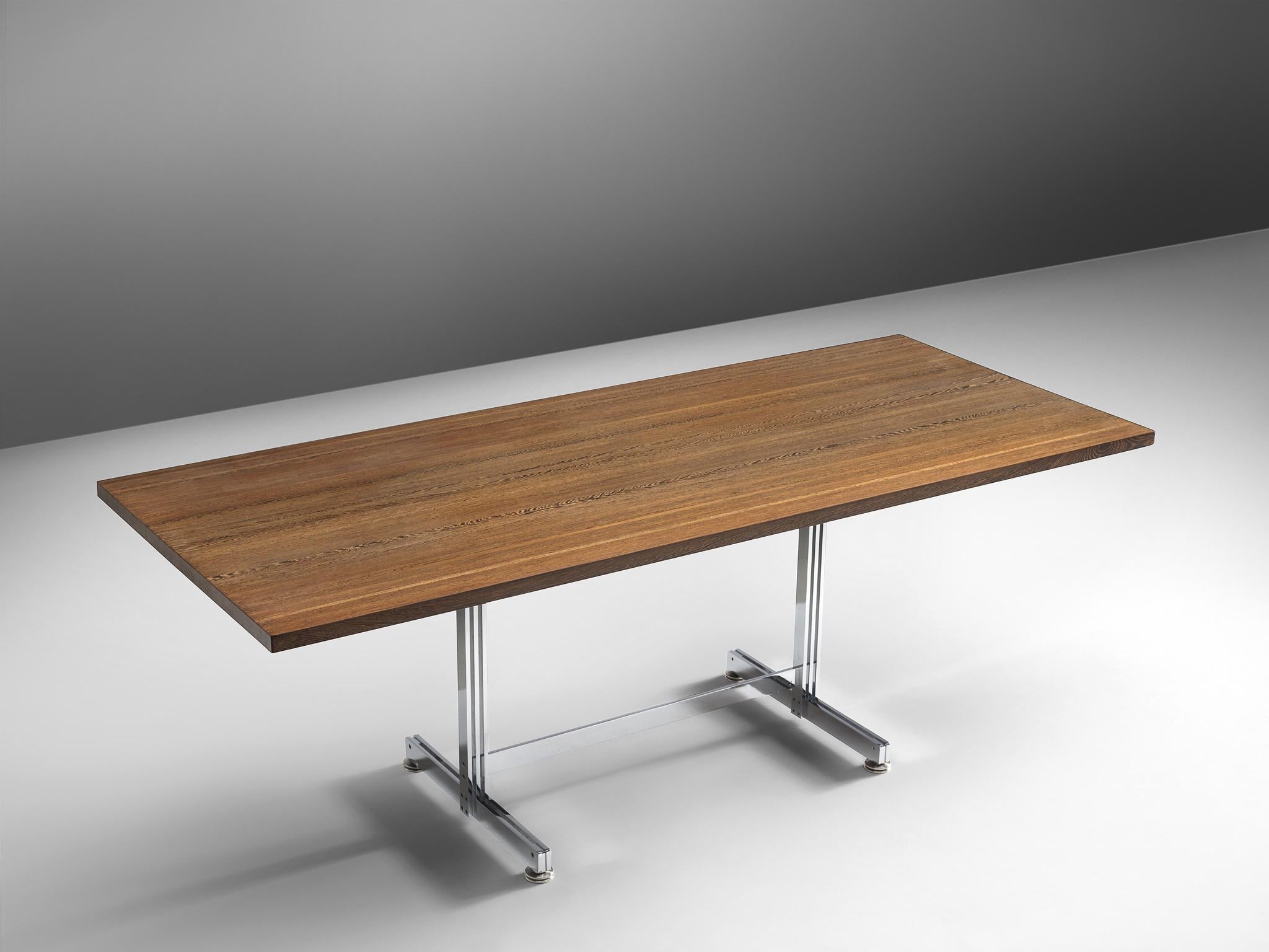 Jules Wabbes, dining table, wenge, steel, Belgium, 1960s

This executive writing table by Jules Wabbes features a solid wenge wooden top, made out of tangentially-sawn wenge slats. Due to the slats, the tabletop features a wonderful pattern in the
