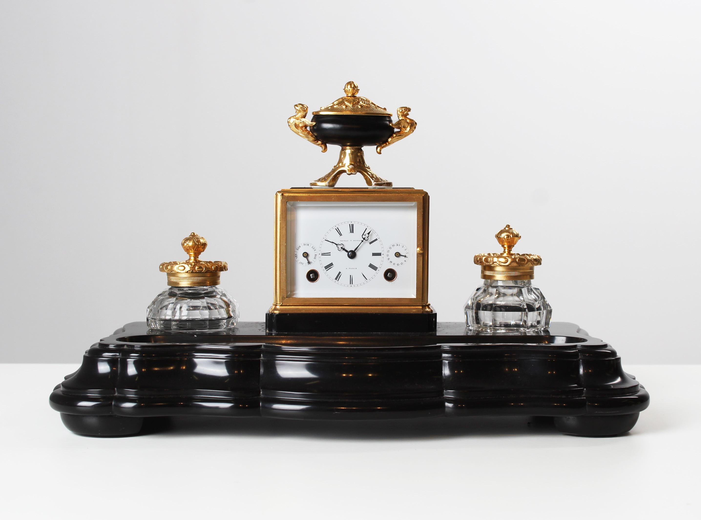 Antique writing set with inkwell and travel clock.
Paris
Brass, marble
Around 1850

Dimensions: H x W x D: 23 x 39 x 20 cm

Description:
Very rare to find antique desk set with pendulette.

Marble base standing on round feet. In the front