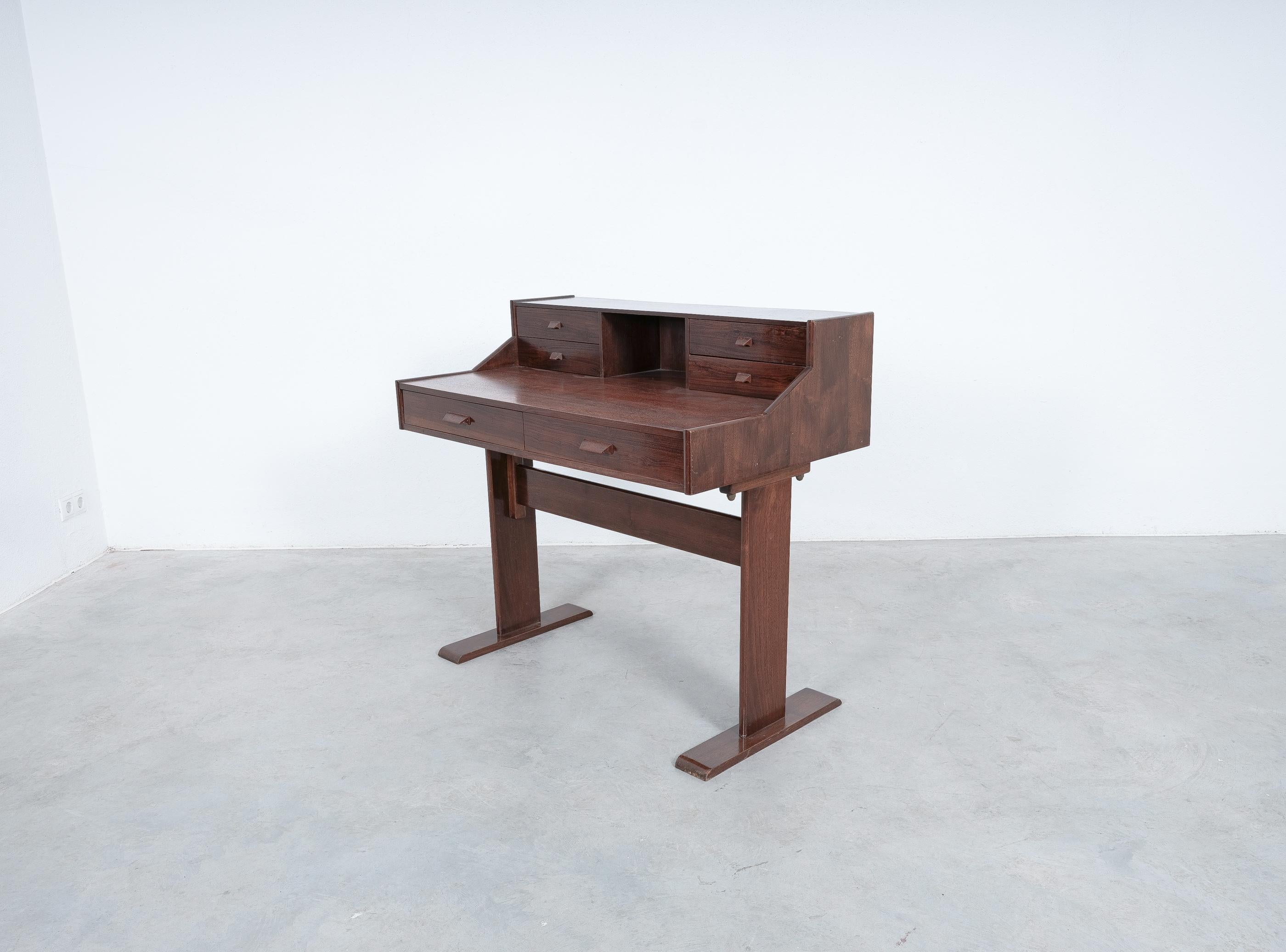 Writing desk, teak and veneer with many drawers, Italy, circa 1970

Dimensions are: 41.3
