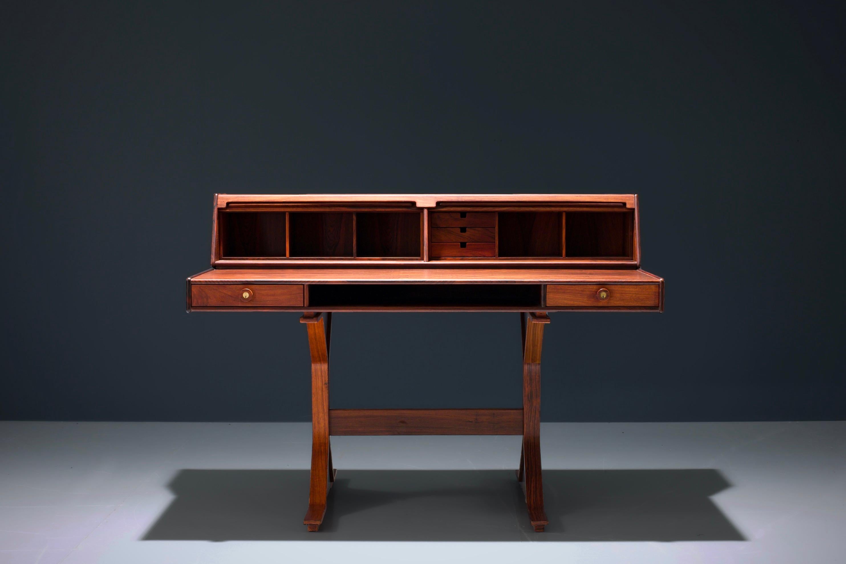 Rosewood Writingdesk with tambours shutters by Gianfranco Frattini for Bernini in marvellous condition. The desk comes from a house near Napoli and has never seen any sun nor was it used a lot, resulting in a splendid version. The wood is still very