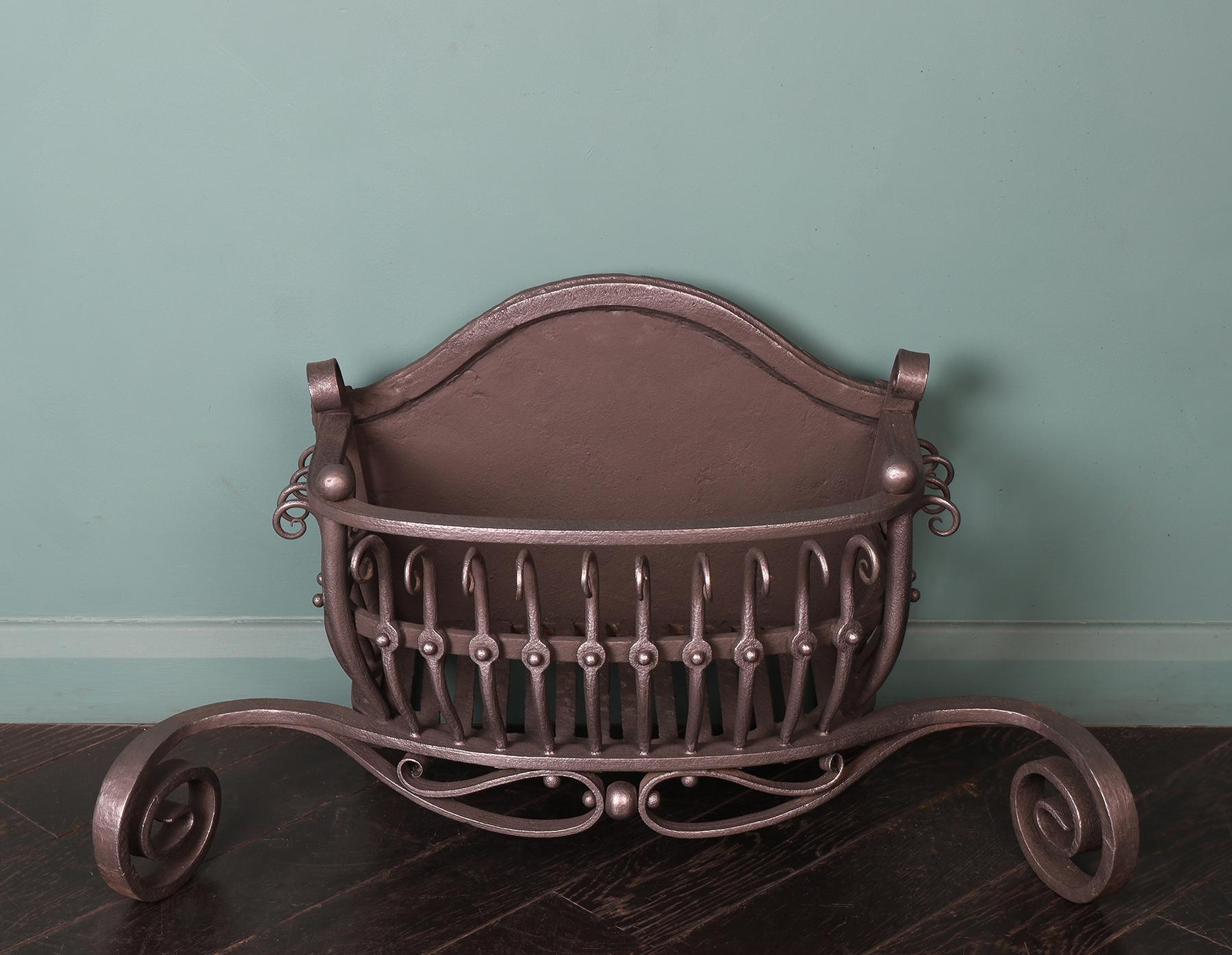 A bow-fronted wrought fire basket with delicately sculptured vertical fire bars ending in fine scrolls. The basket is supported on scrolled dog legs. This fire basket is suitable for burning coals or logs. Restored.
Height of burning area: