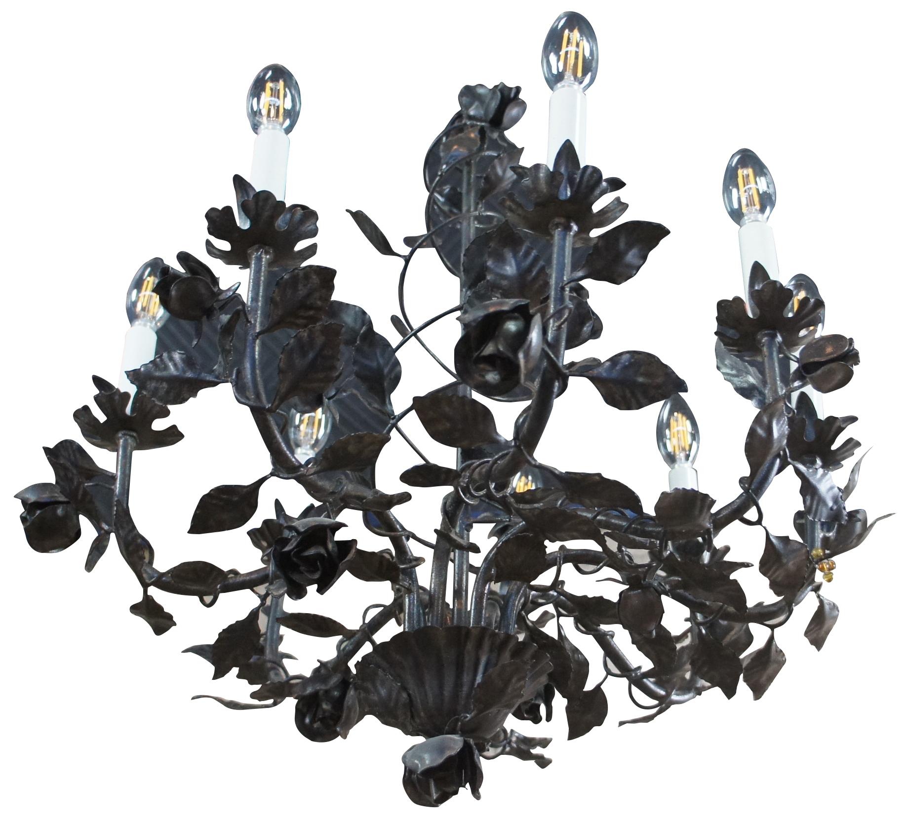 Vintage eight arm wrought iron chandelier featuring roses on a vine with spiral and scrolled design. Measure: 25