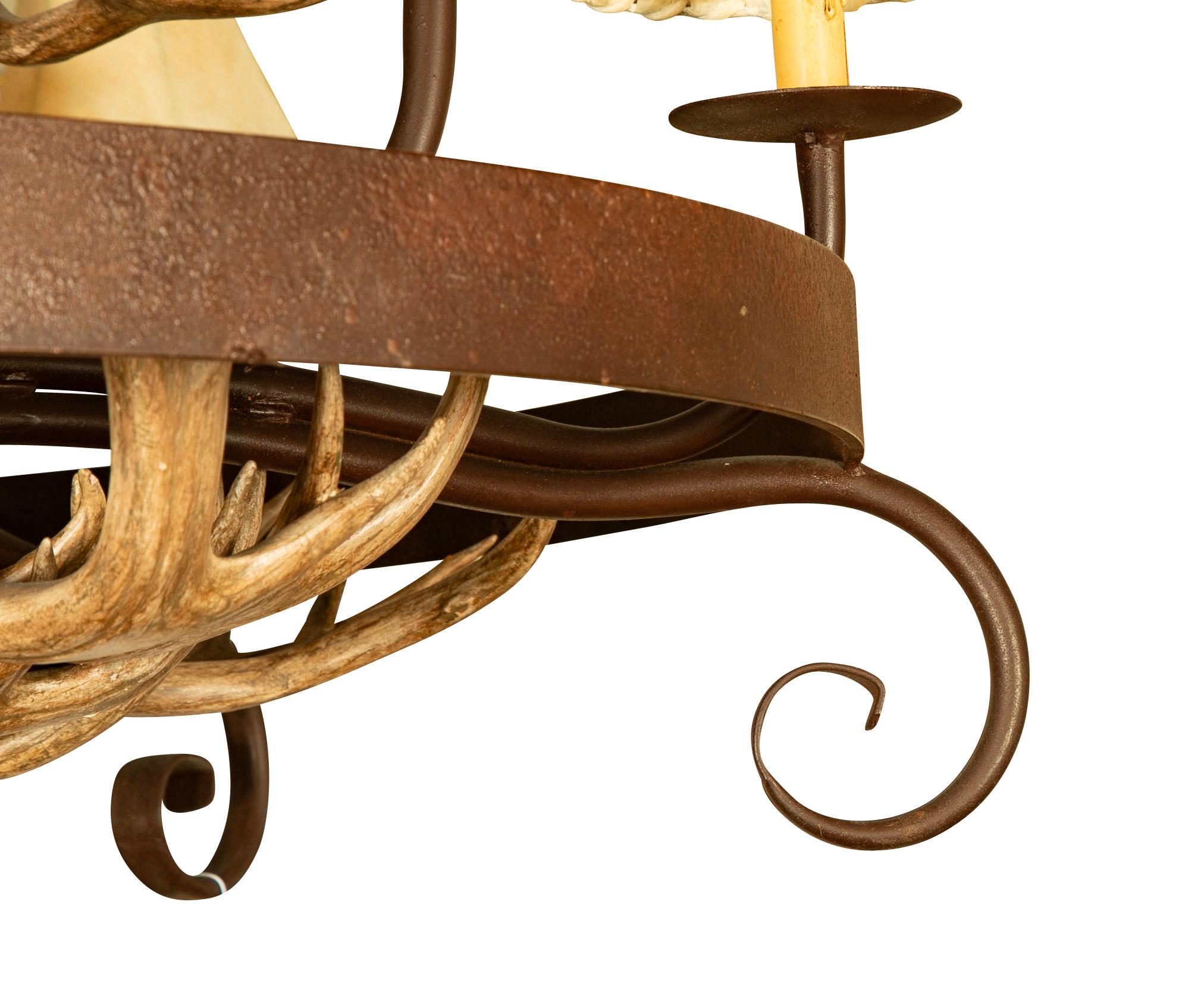 20th Century Wrought Iron and Antler 15 Light Chandelier With Rawhide Shades