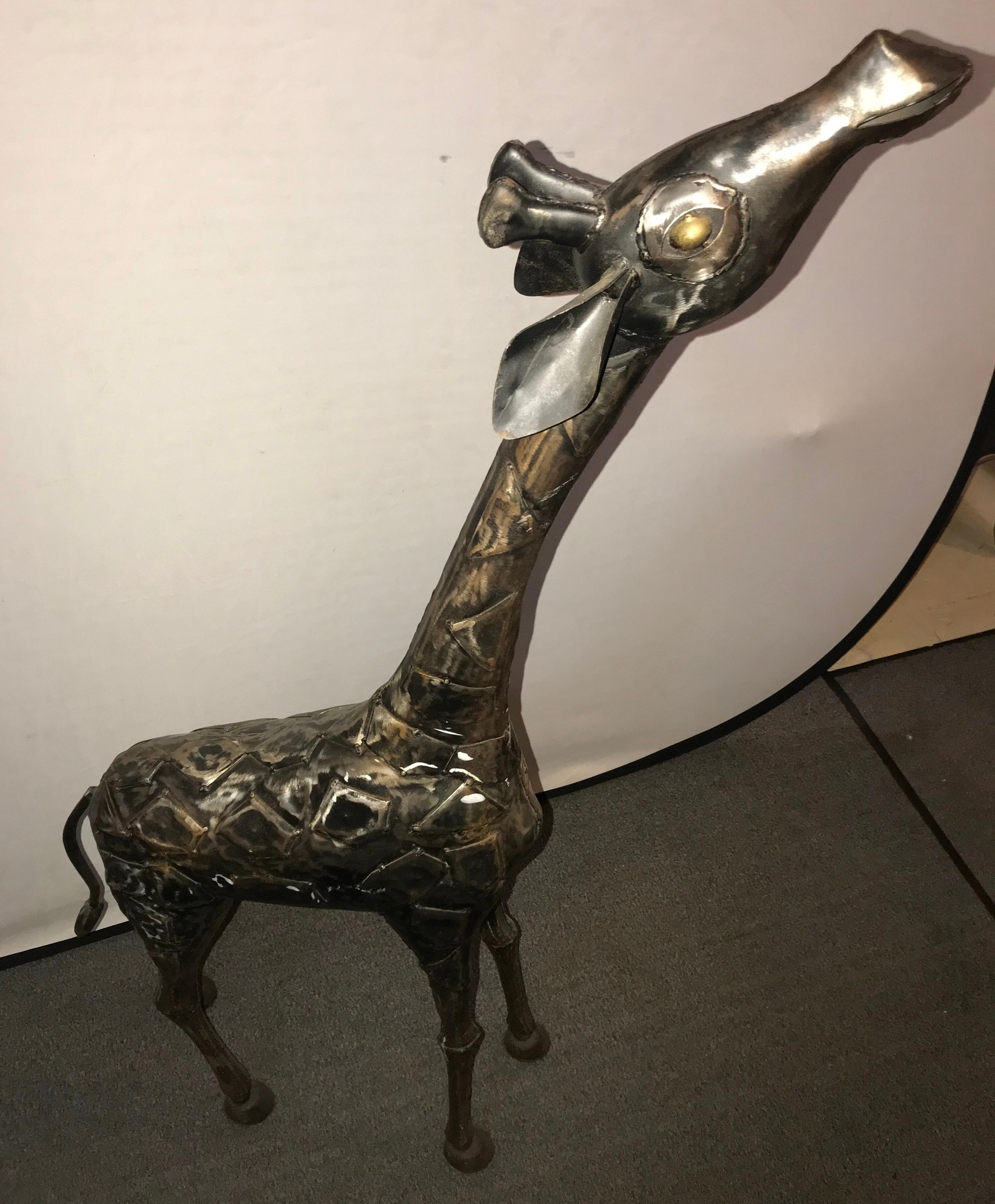 Wrought iron and brass life-sized baby giraffe. Finely detailed and simply adorable is this over four foot tall baby giraffe.
