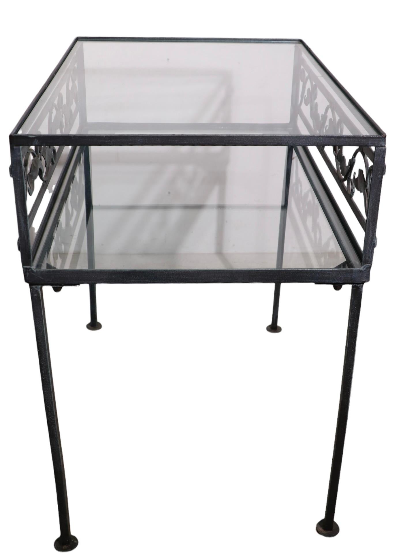 Wrought Iron and Glass Two Tier Garden Patio Table by Meadowcraft In Good Condition For Sale In New York, NY