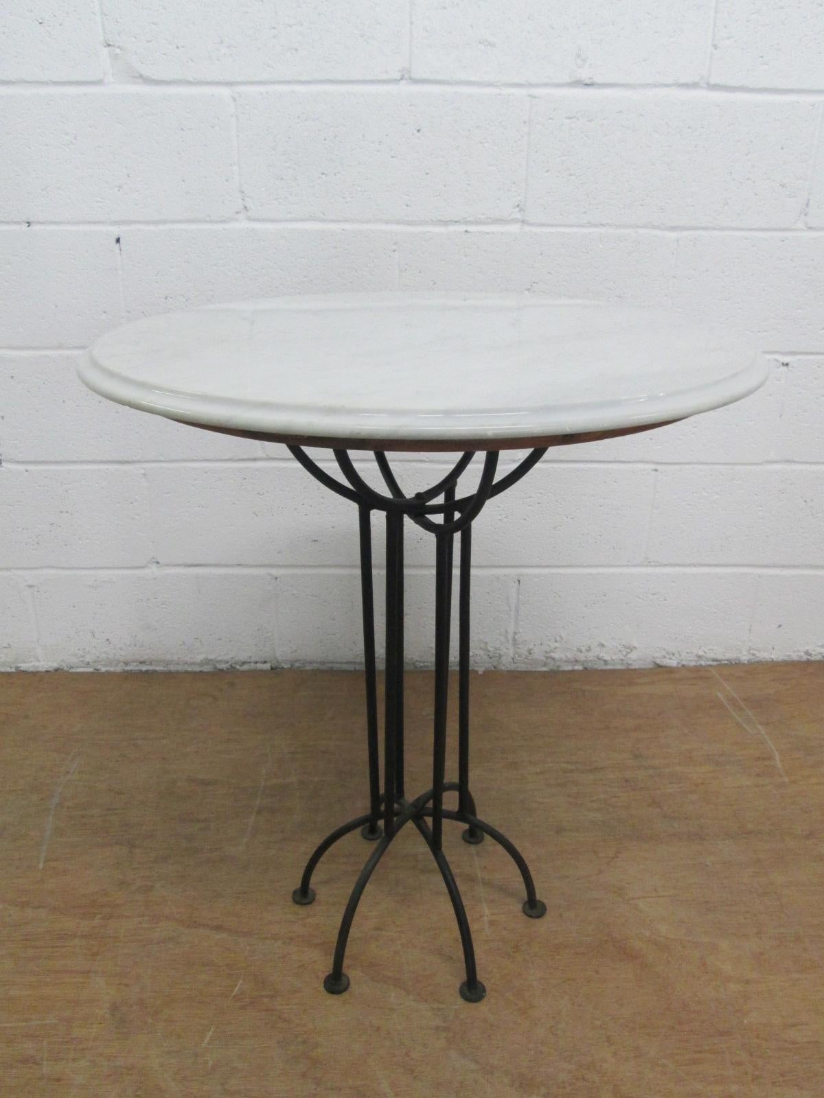 Pair of wrought iron and Italian marble-top tables. Has a spider style base. Gueridon table, occasional table.