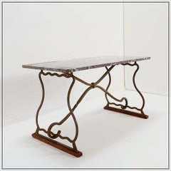 Wrought iron and marble coffee table in the style of Gilbert Poillerat