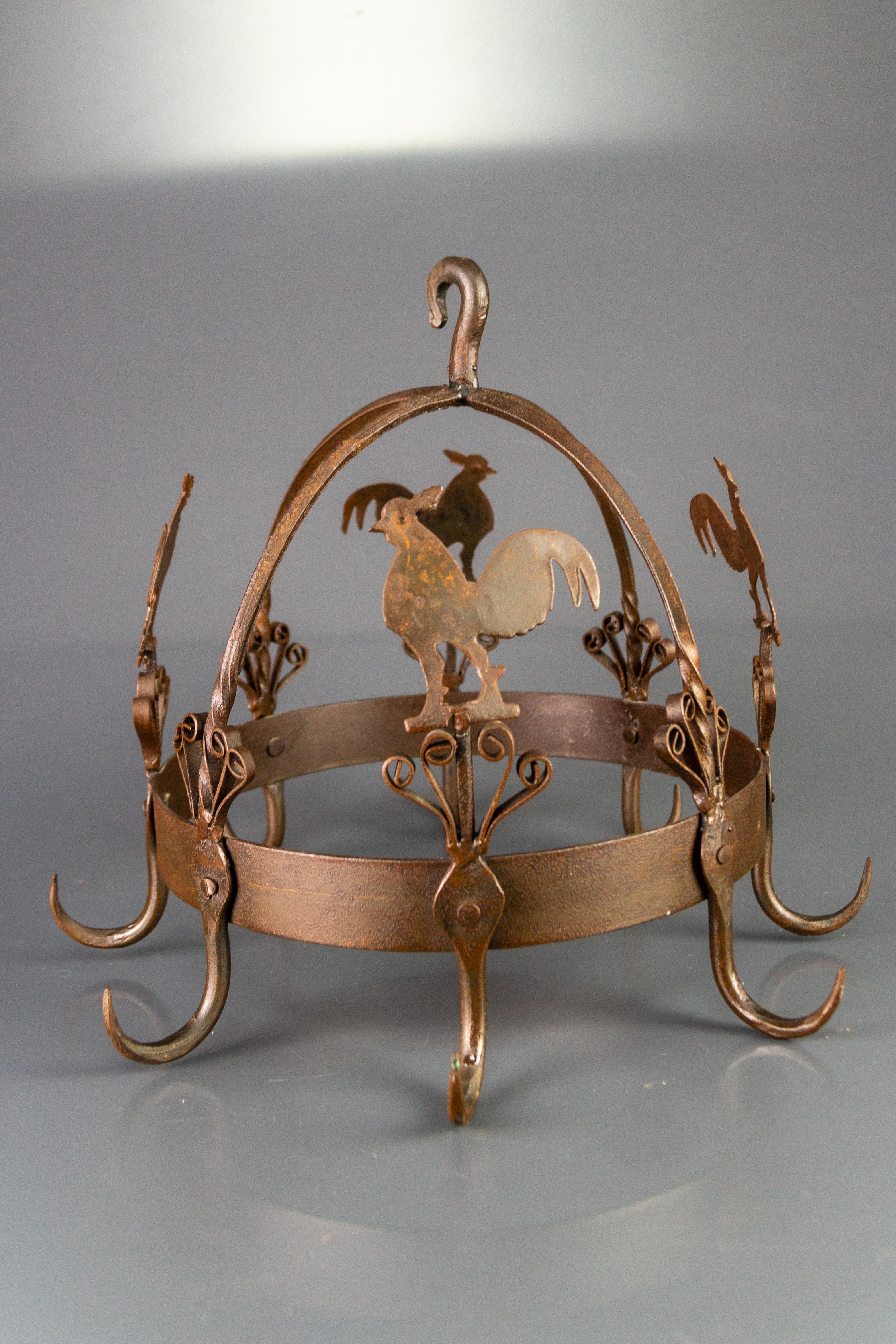 Adorable wrought iron and metal pot and pan or other kitchen utensils hanger, highlighted with rooster figures and scroll decors. This wonderful pot rack is the perfect combination of form and function, a decorative and practical accent in any