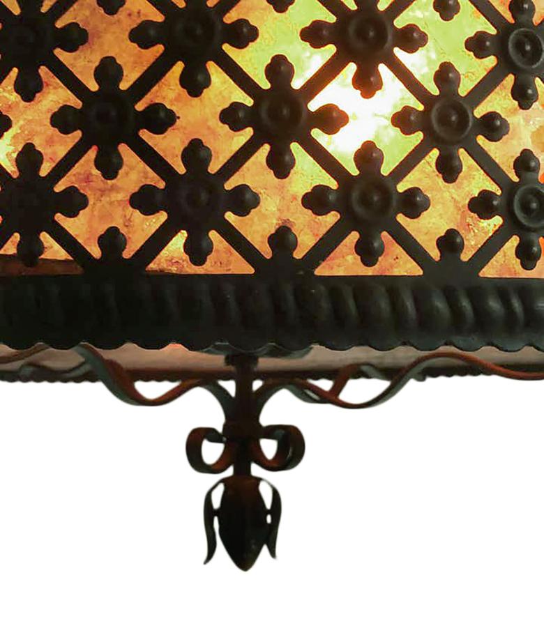 A circa 1940's American wrought iron chandelier with mica insets and interior lights.

Measurements:
Height 24