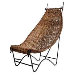 Fauteuil en fer forgé et rotin, années 1950.