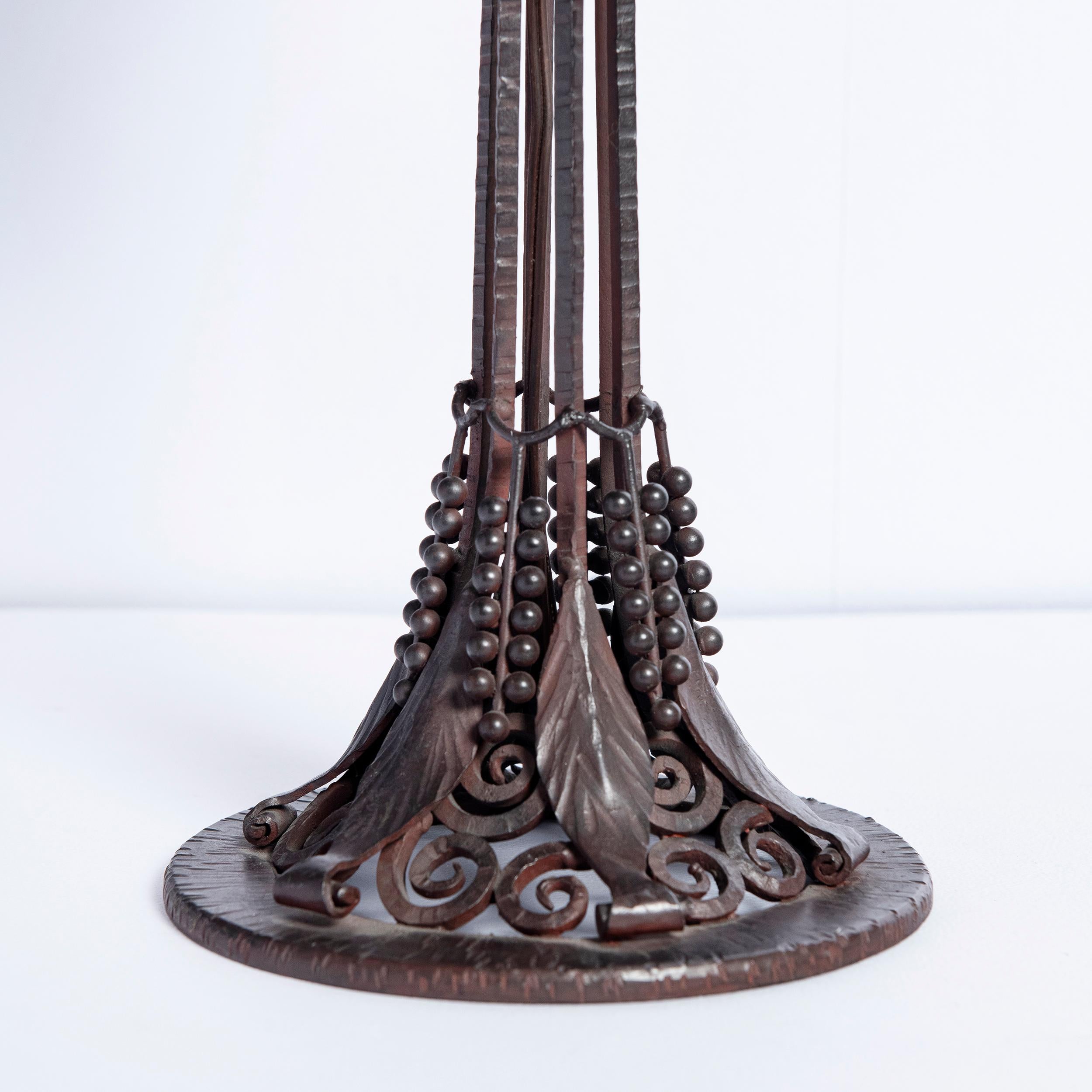 Wrought iron and Schneider glass table lamp, France, circa 1920-1930.
