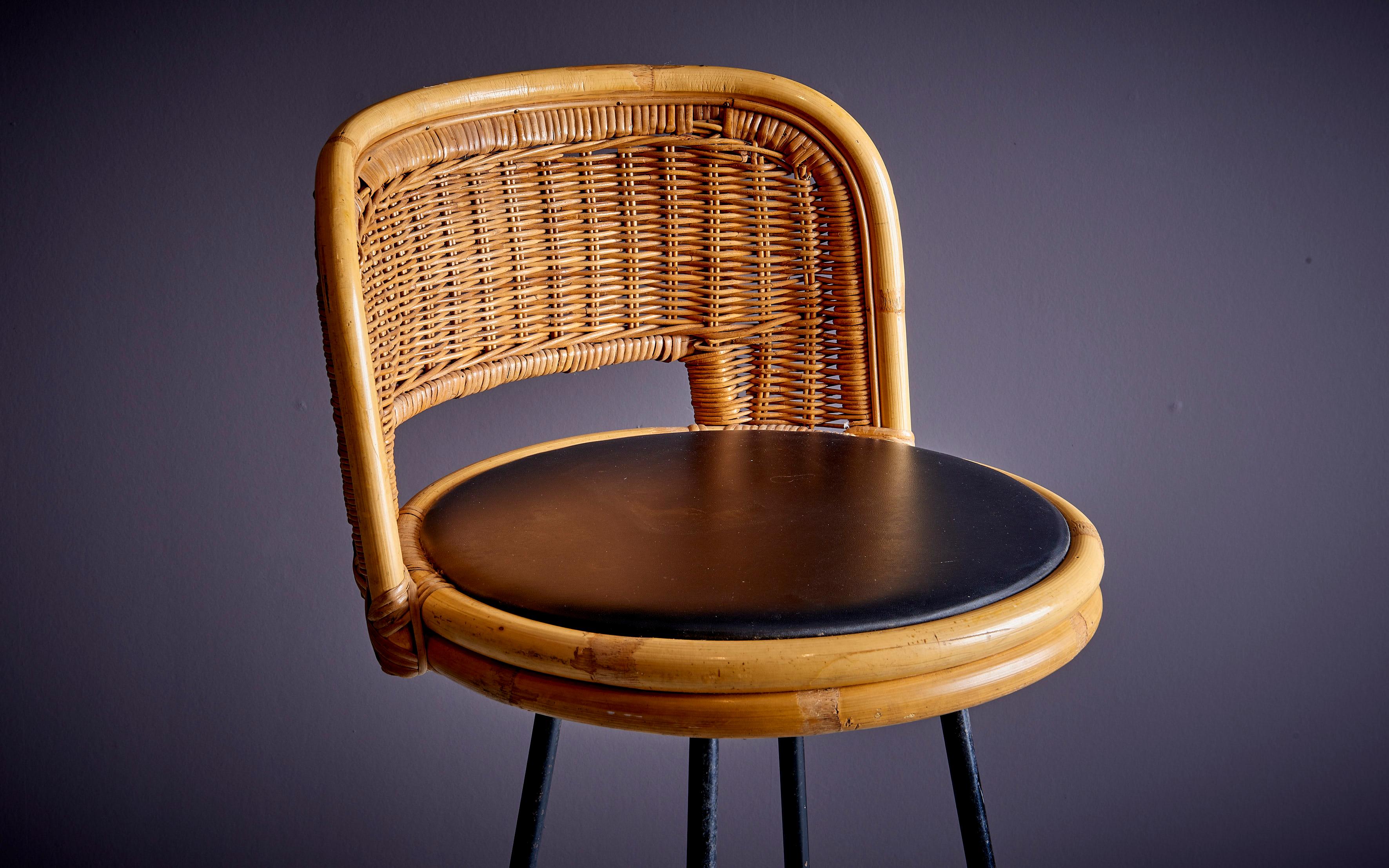 bar stool designed by Danny Ho Fong with wrought iron base and wicker/bamboo seat. The diameter given applies to the diameter of the seat. The base of the stool measures ⌀42cm. 