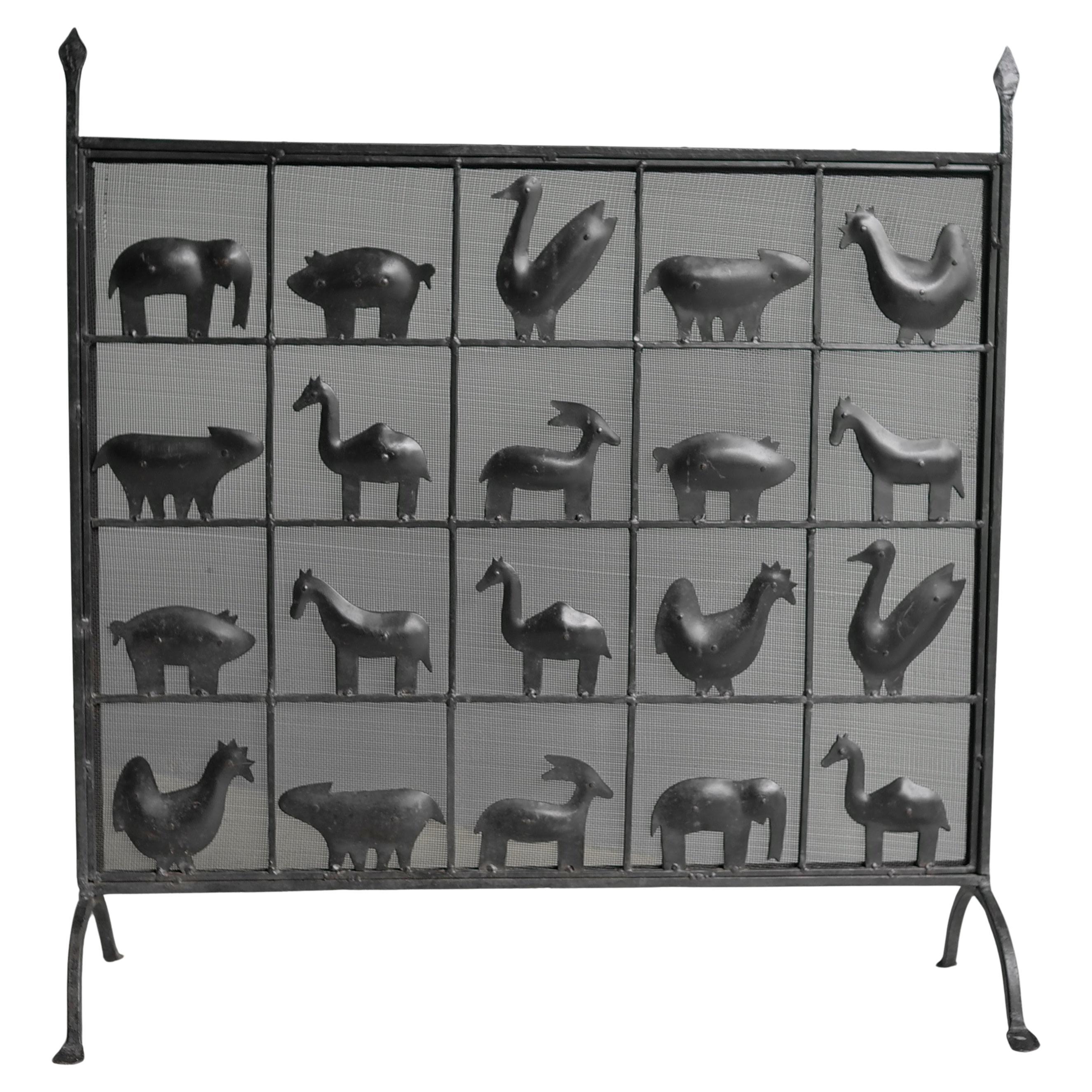 Wrought iron animal fire screen by Atelier Marolles, France, 1955. Very decorative and useful piece with dense mesh against the sparks.