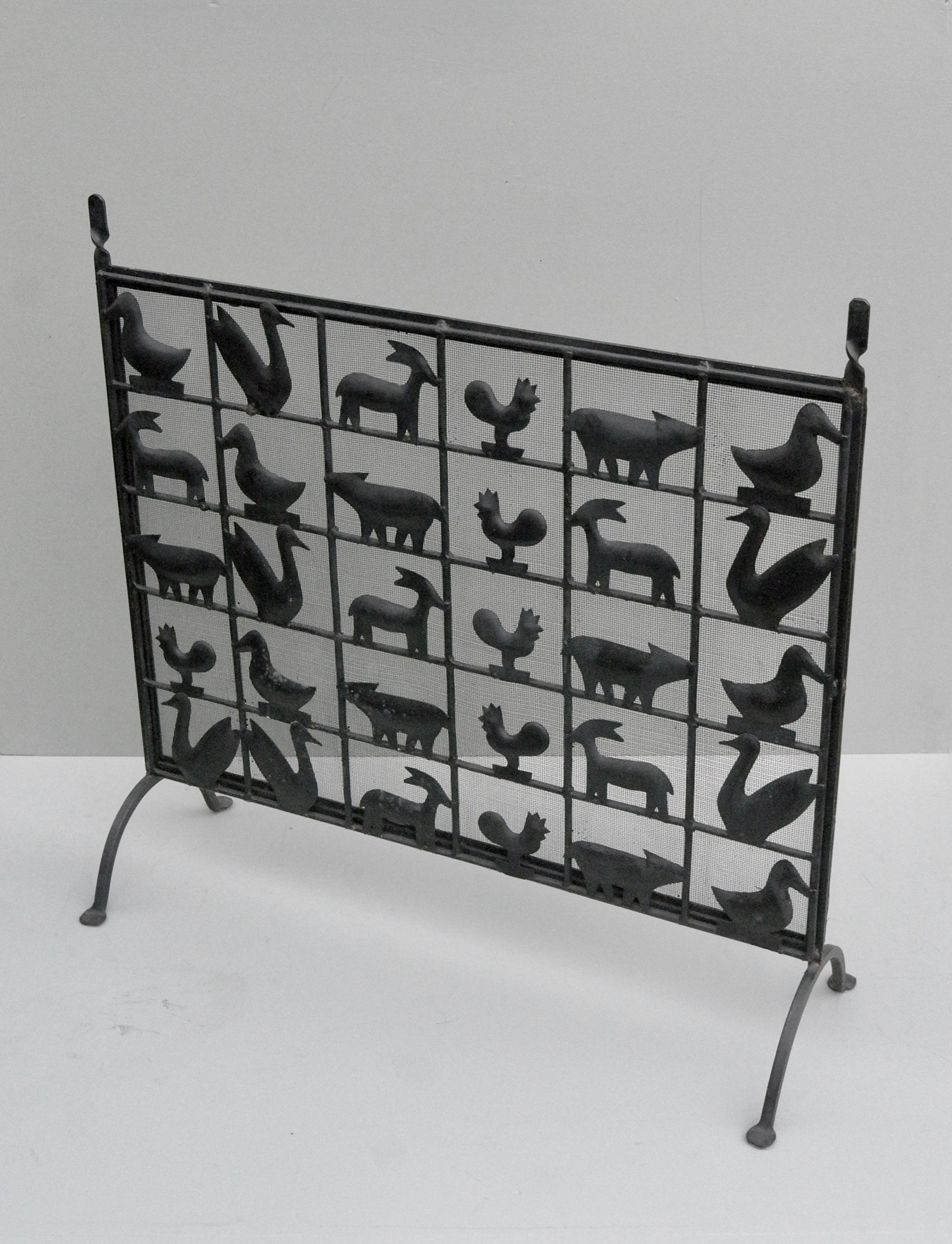 Wrought iron animal fire screen by Atelier Marolles, France, 1955. Very decorative and useful piece with dense mesh against the sparks.
