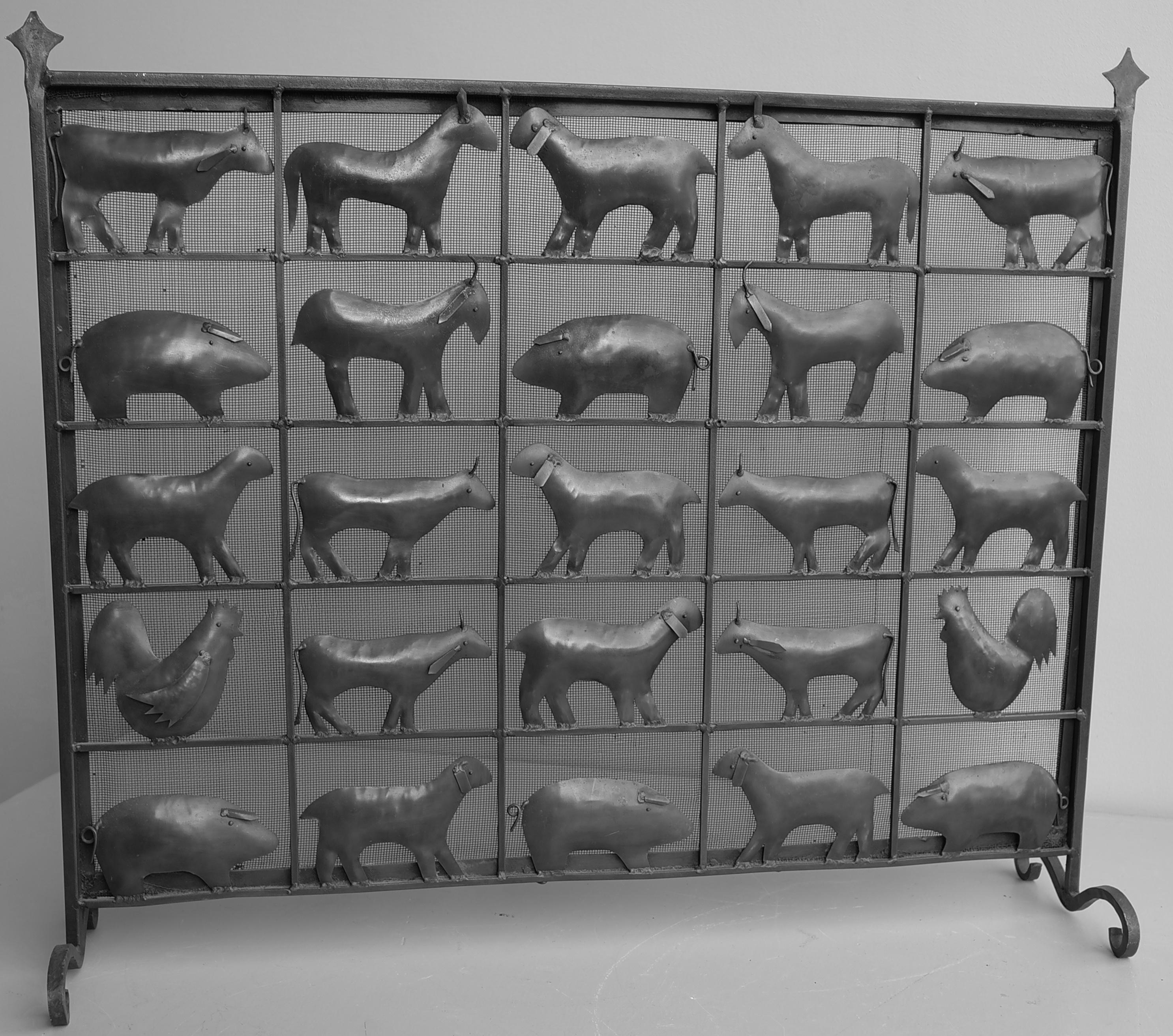 Wrought iron animal fire screen by Atelier Marolles, France, 1955. Very decorative and useful piece with dense mesh against the sparks.


