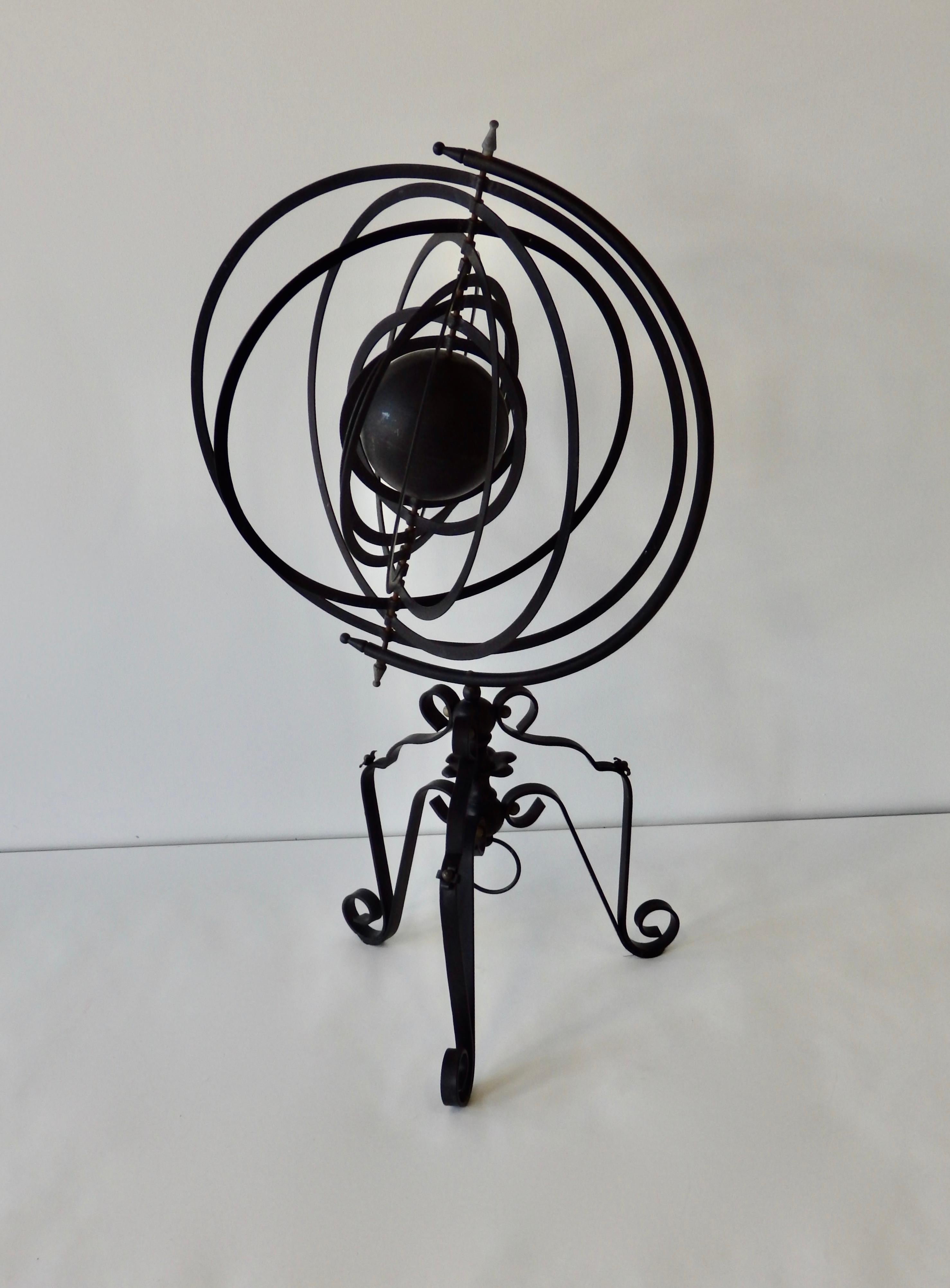 Painted black, this wrought iron armillary is based on the Copernican Heliocentric universe with nine outer spheres in rotation around a central sun.
Diameter of rings is 21.5', 39.5