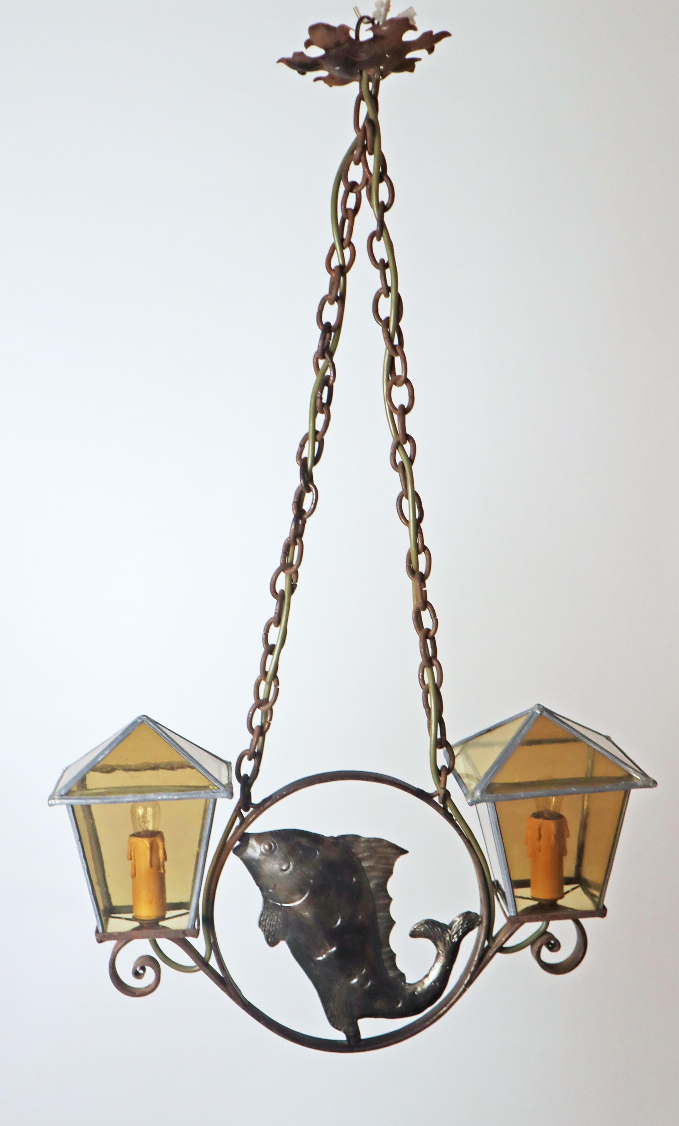 Exceptional and rare lamp from the 1920s. They are 2 lamps with a damaged glass on the lampshade but stable in that it cannot fall out therefore these two show marks of previous use as detailed in the photos. 
This is a very rare offer of