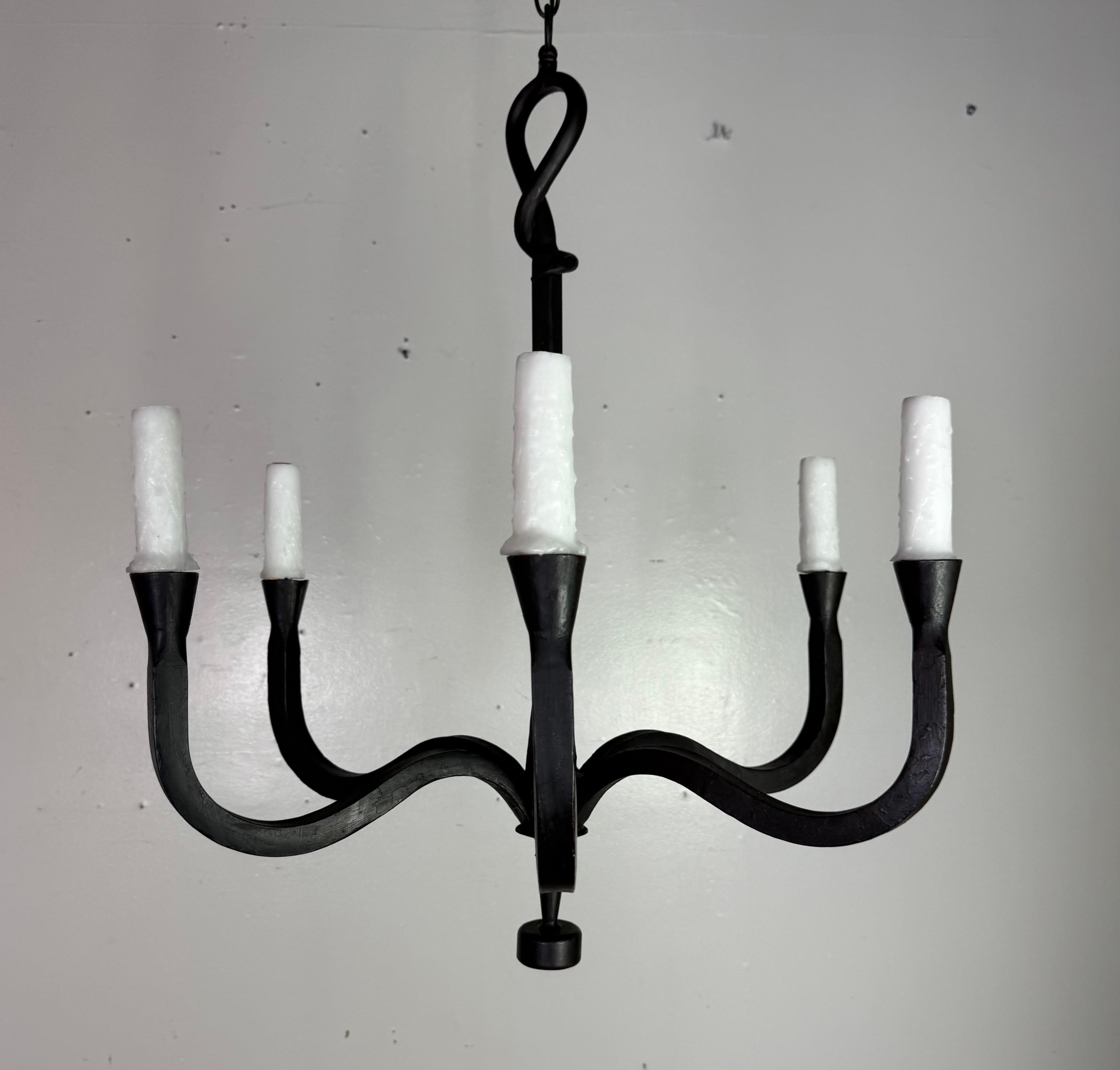 Hand-Forged Iron Eight-Light Chandelier by Miamar Home

A striking hand-forged iron chandelier featuring eight sweeping arms in a minimalist yet sculptural form. This piece evokes the rustic elegance of French country lighting and the bold