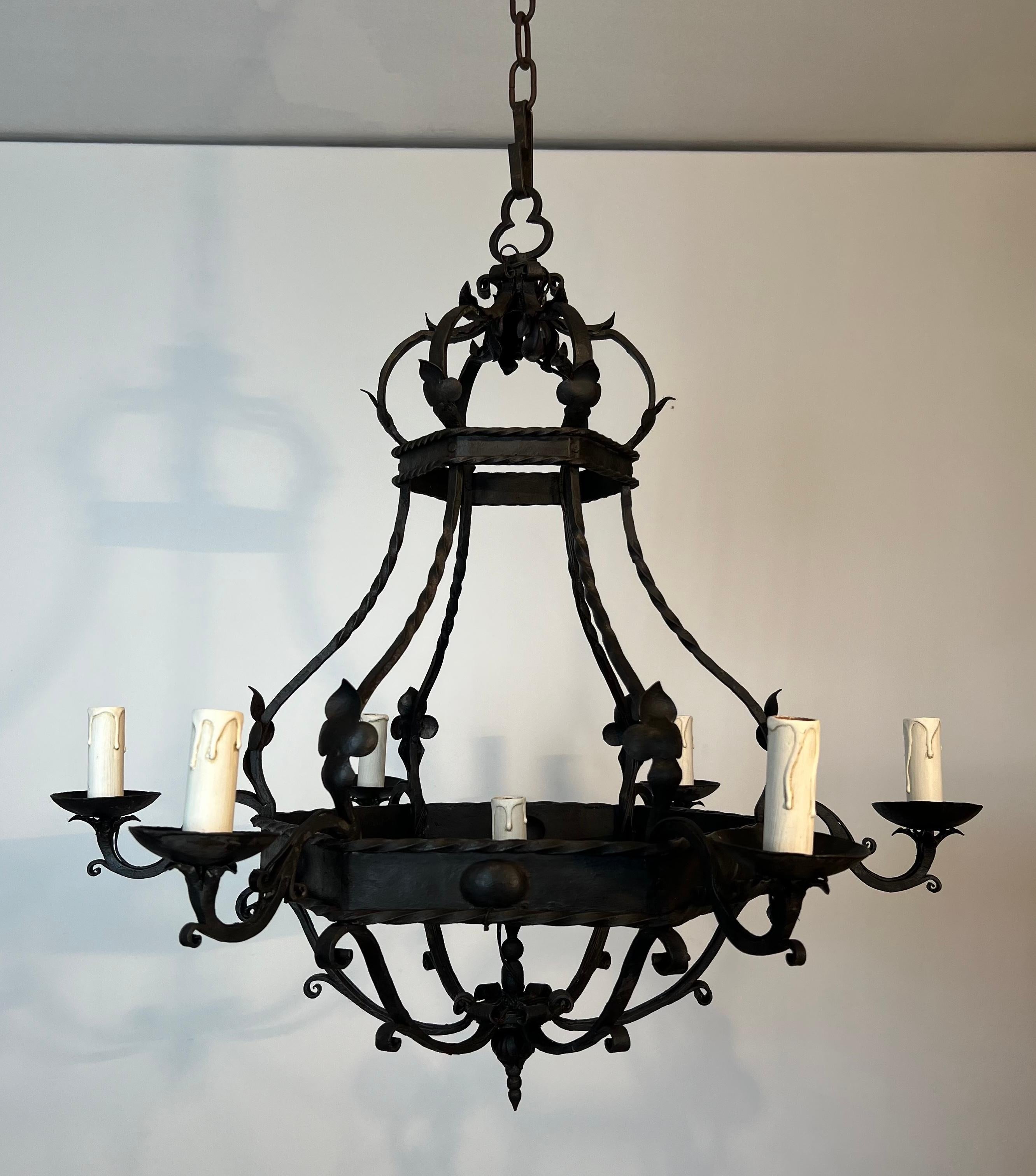 This very nice cage chandelier with 7 lights is all made of  wrought iron. This is a French work in the Gothic style. Circa 1950