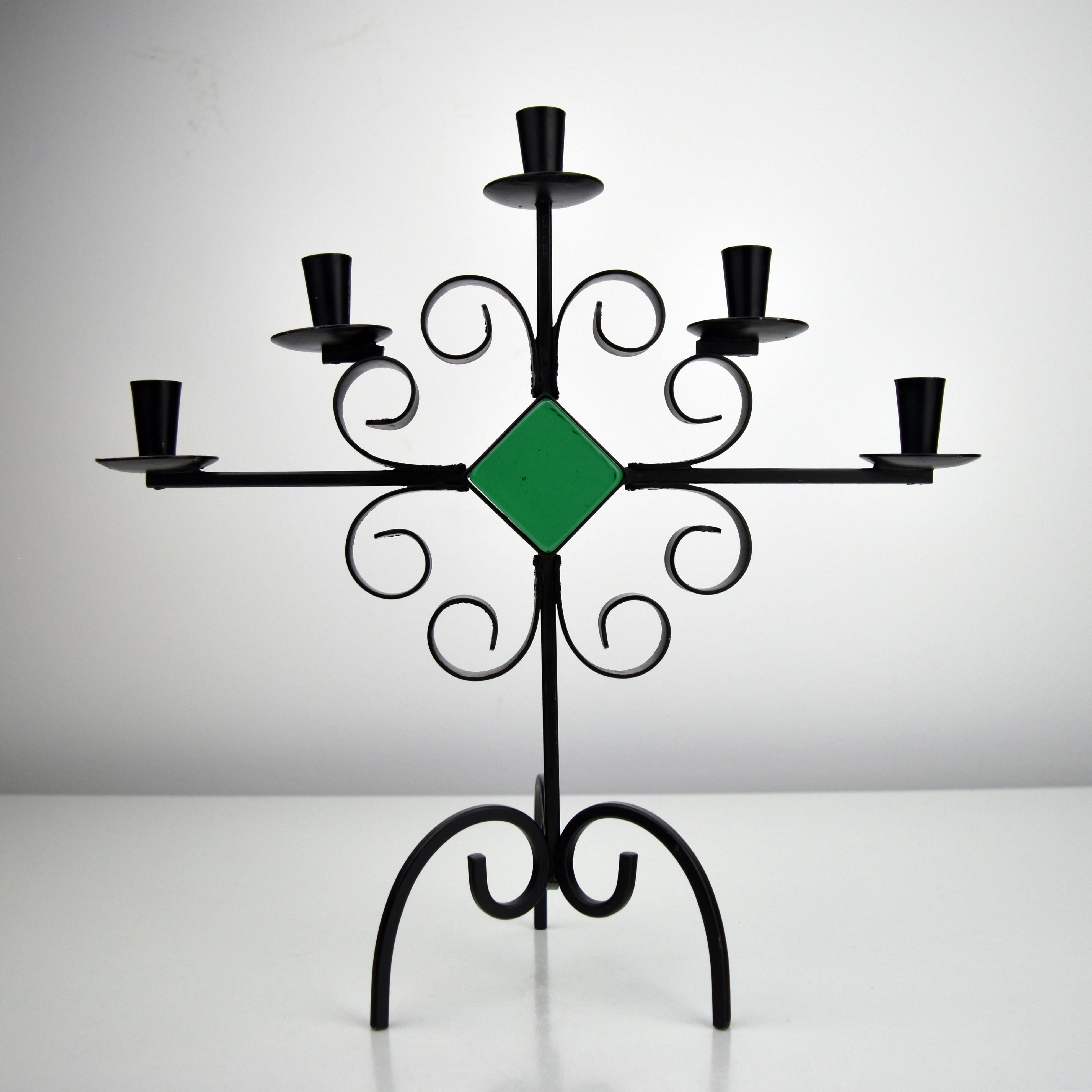 A beautiful wrought iron candelabra, designed by Gunnar Ander for the Swedish manufacturer Ystad Metall in the 1960s.