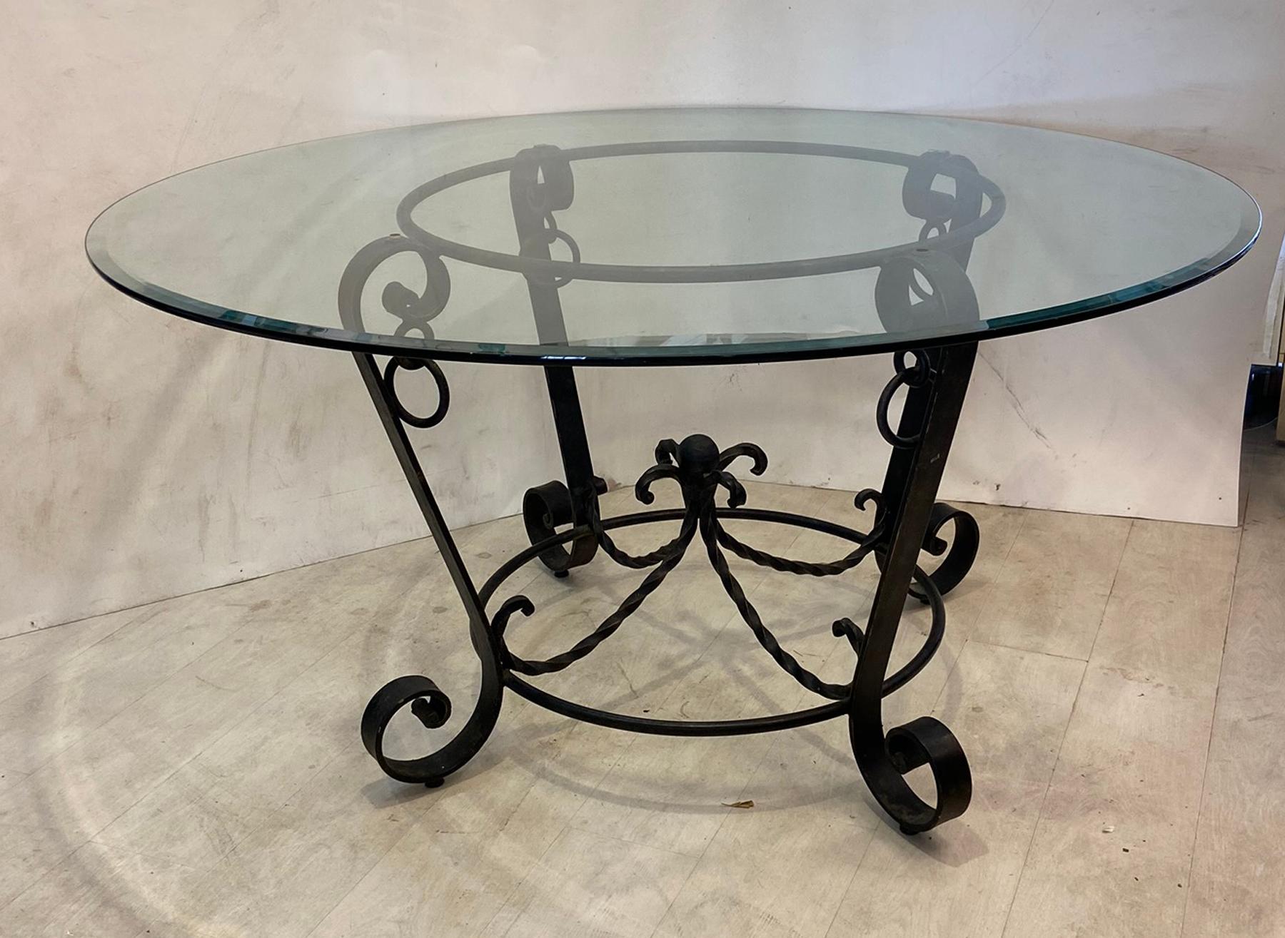 Vintage wrought iron center table in the style of Gilbert Poillerat. Could also be used as dining table or parlor table.