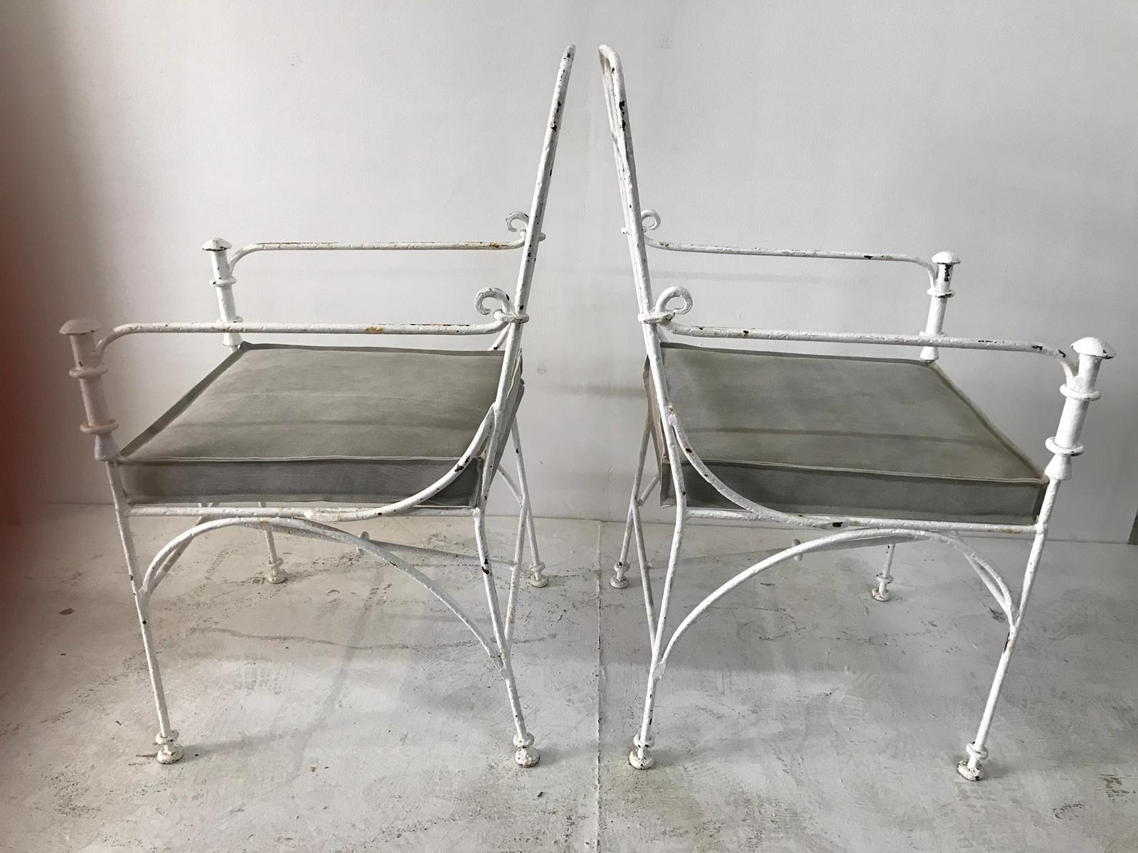 Fantastic heavy iron chairs in the style of Diego Giacometti Style, circa 1970's.
Very heavy and high quality work. with a white plastered finish, they show age and Patina, natural light gray leather cushion.