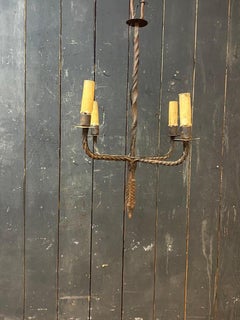 Wrought iron chandelier circa 1950 illuminated by 4 lights