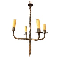 Wrought iron chandelier circa 1950 illuminated by 4 lights