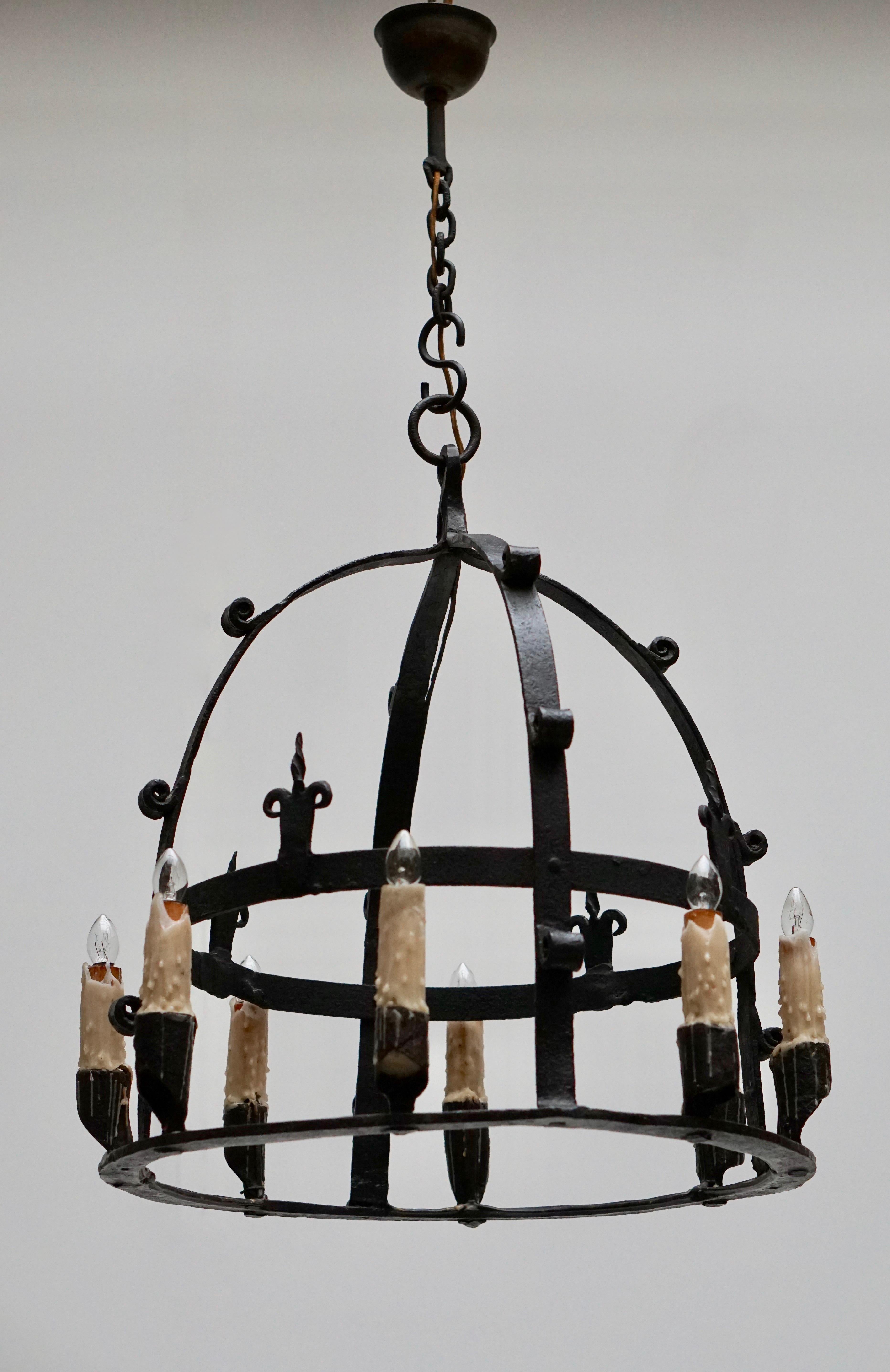 Wrought iron chandelier. Belgium.
Measure: Diameter 52 cm.
Height fixture 52 cm.
Total height including the chain 87 cm.