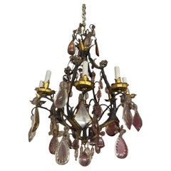 Wrought iron chandelier with somptuous crystal