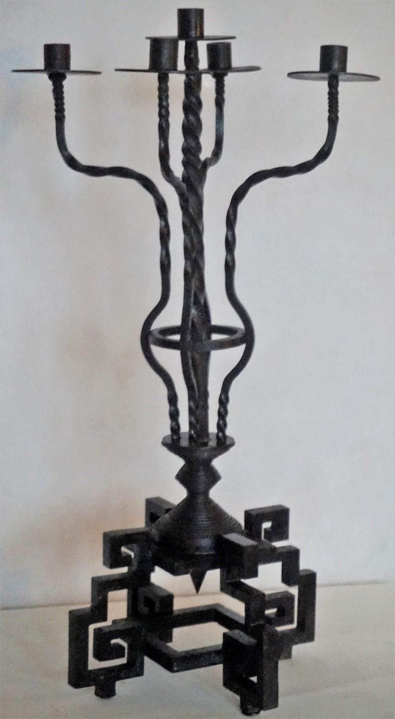 A rare Italian heavy wrought iron church five-light torchère, black painted raised on a large square geometric base, Italy, early 19th-century. This torchére is in good condition, with original black paint, cleaned, signs of oxidation and remained