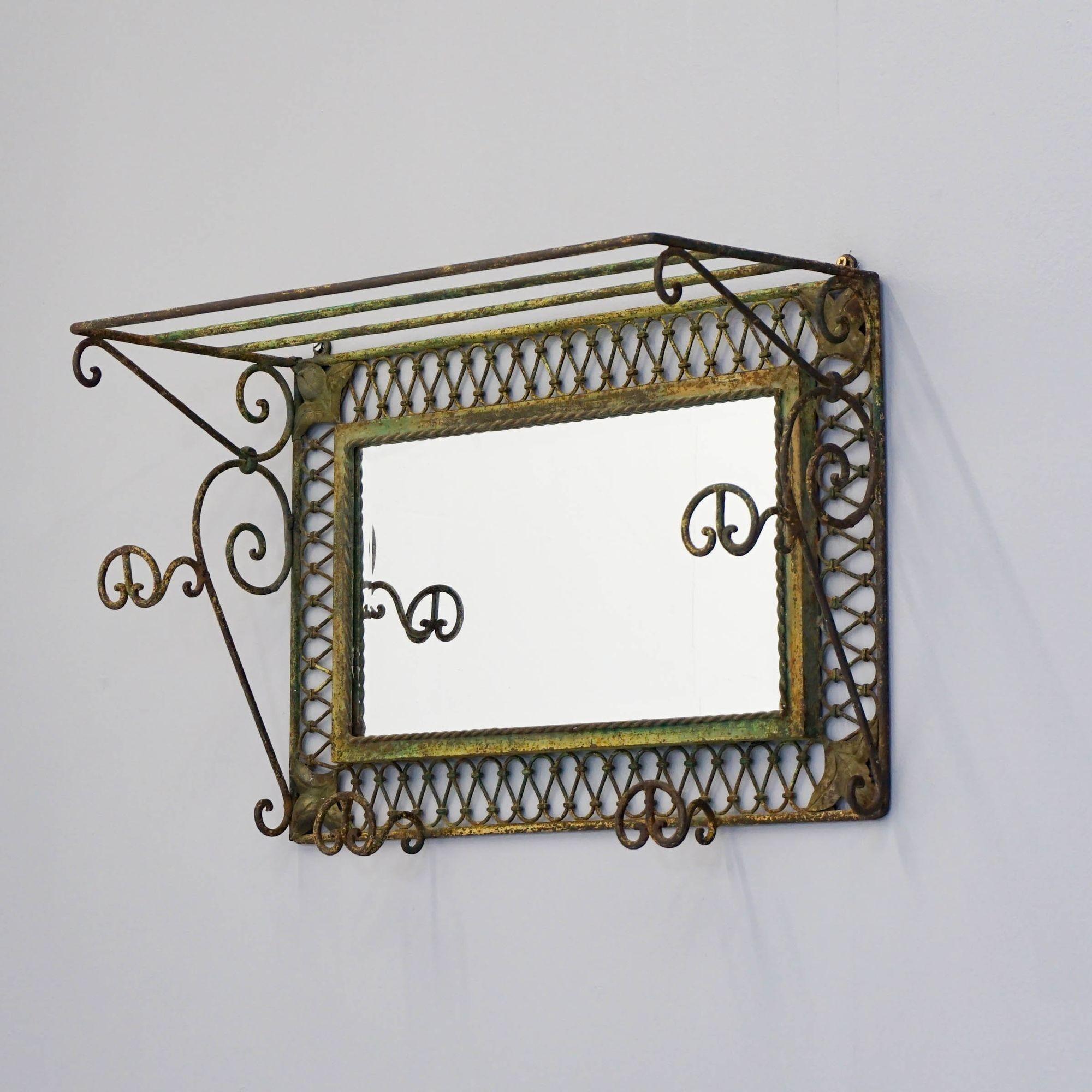 Mid-Century French hall mirror with coat hooks and luggage rack. In original green paint.

Dimensions:
H 42cm x W 68cm x D 27cm
