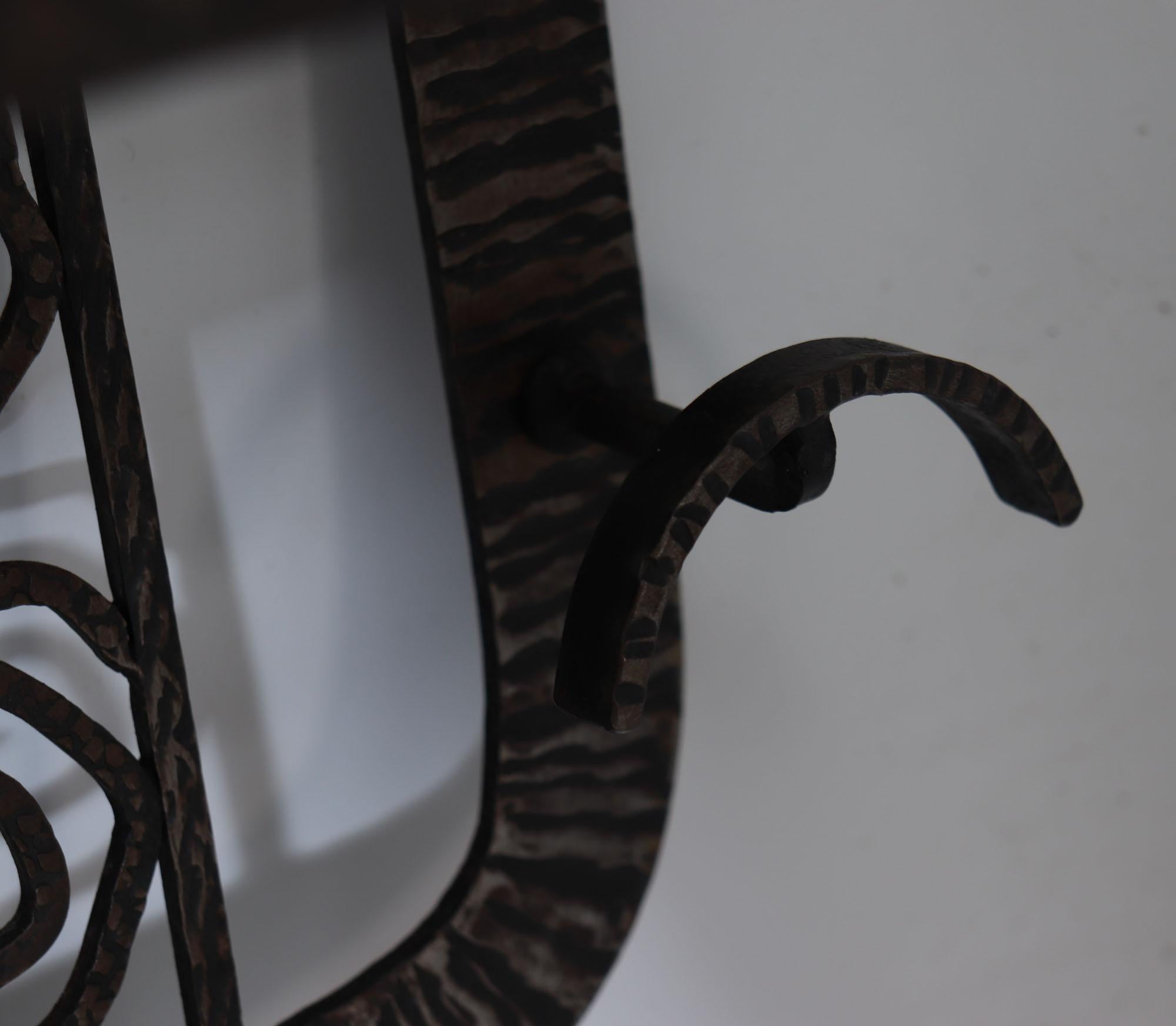 Coat rack mirror by Paul Kiss
A silvered wrought iron hand chased and hammered with intricate and fine detail, having four hooks for coats and central mirror with shelf for hats or a bag, very stylish design by kiss who was a student of Edgar