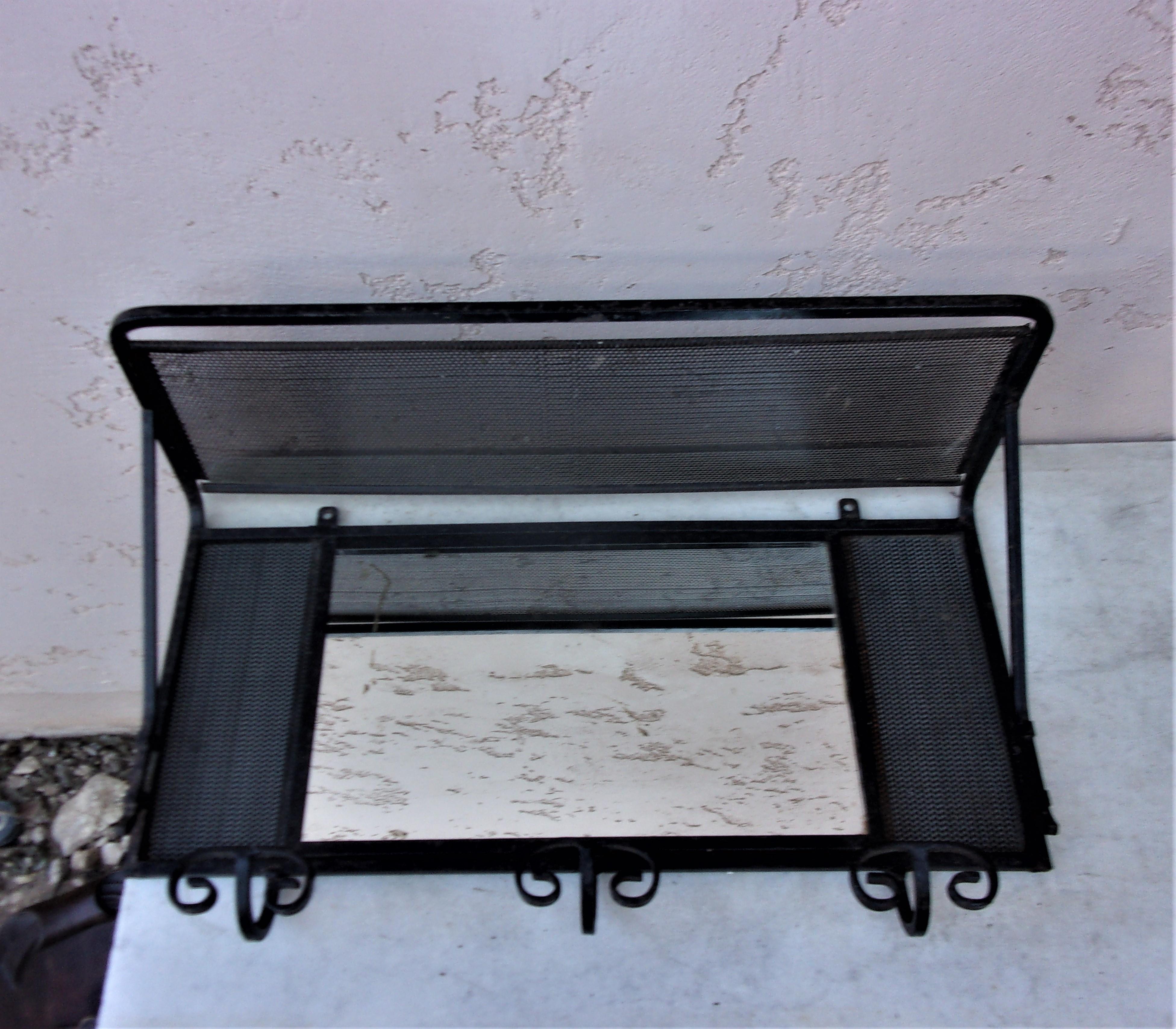 French wrought iron coat rack with mirror circa 1940.