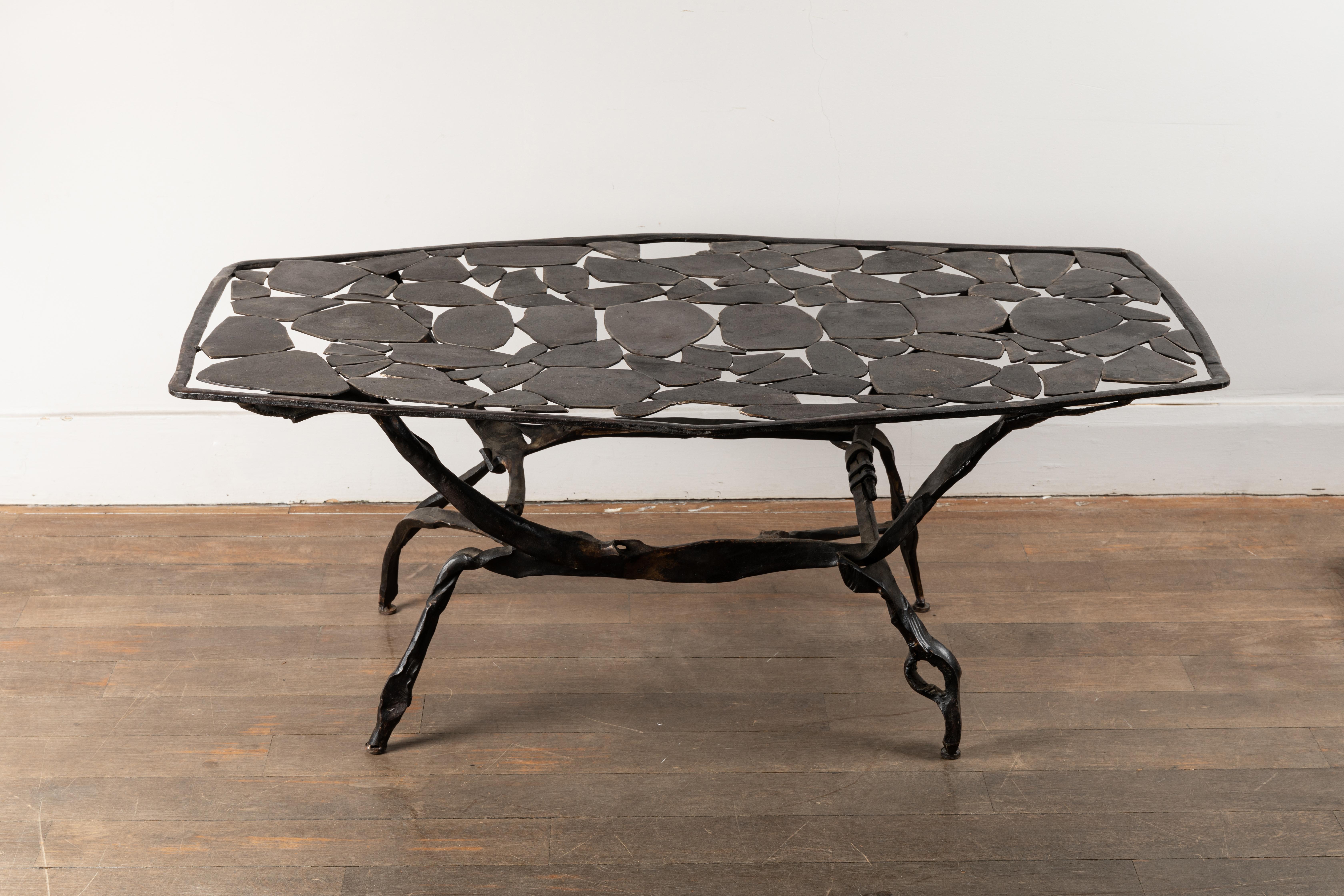 Coffee table by Nicolas Thevenin.
Forged iron.
Signed and dated: Nicolas Thévenin, Cannes 2014.
Nicolas Thévenin is the son of metal artist François Thevenin (1931-2016) and worked in his father's workshop.  

Dimensions (H x W x D):
46 x 117