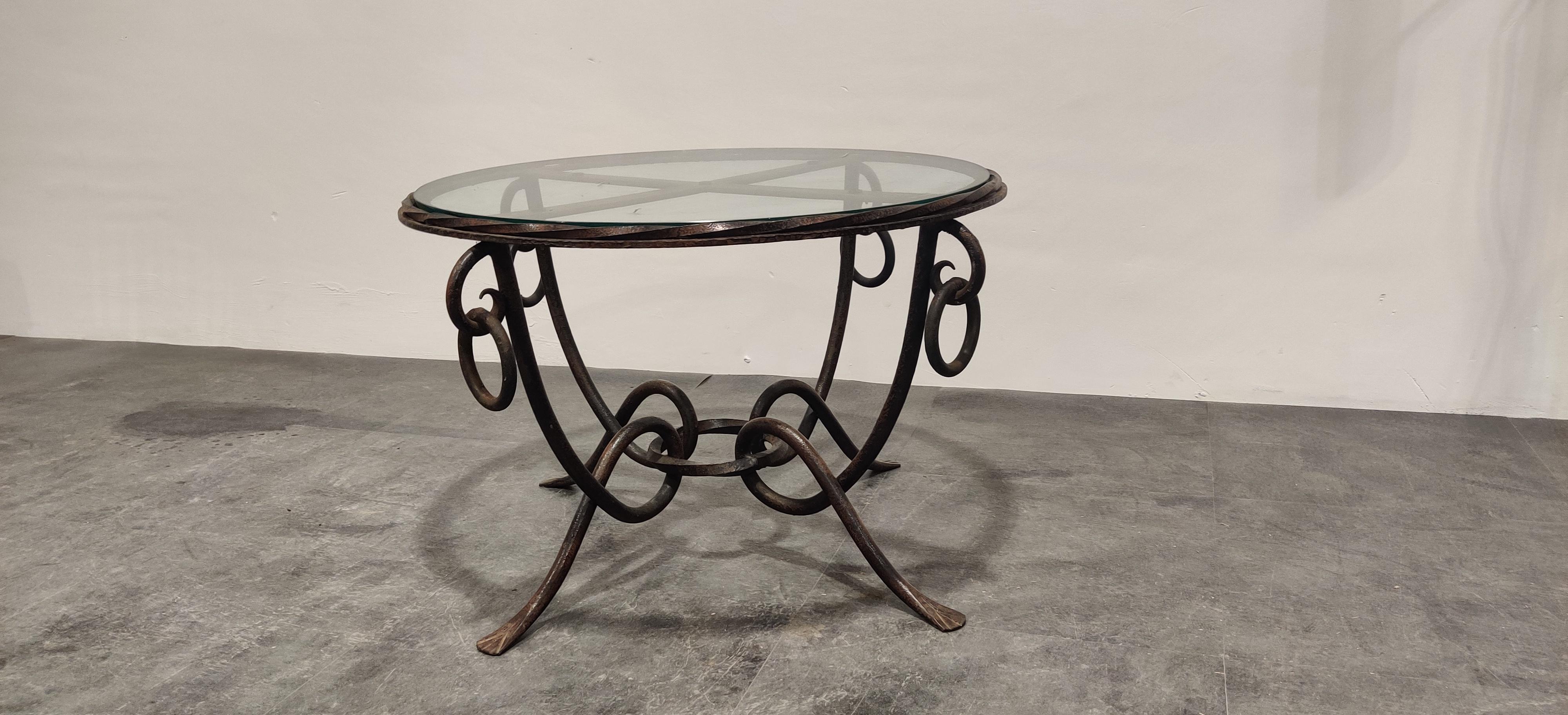 Vintage coffee table designed by René Drouet (1899–1993).

The table has a gilded wrought iron base and a glass top.

Great craftsmanship.

1940s - France

Dimensions:
Height 48cm/18.89