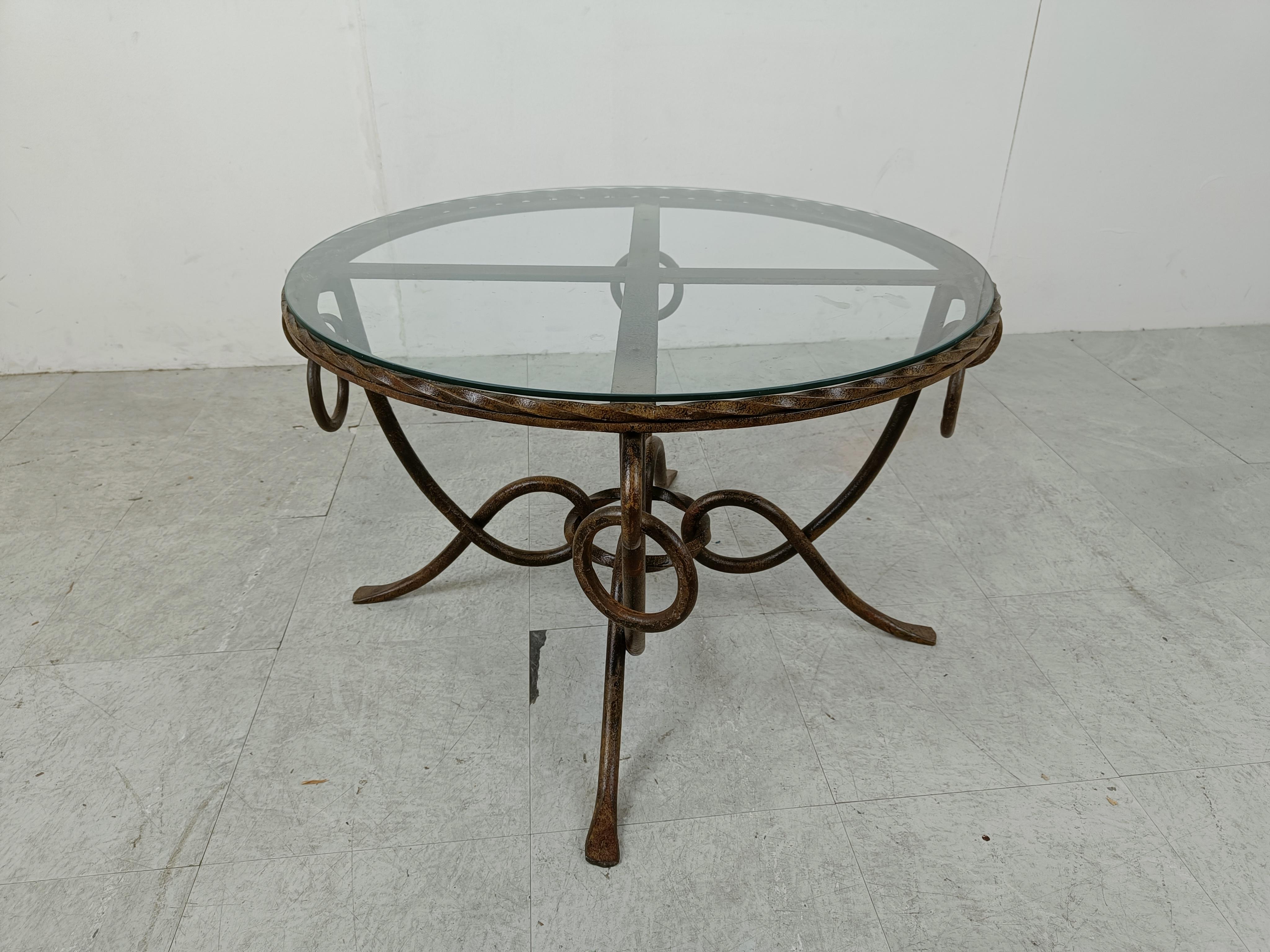 Vintage coffee table designed by René Drouet (1899–1993).

The table has a gilded wrought iron base and a glass top.

Great craftsmanship.

1940s - France

Dimensions:
Height: 47cm/18.50