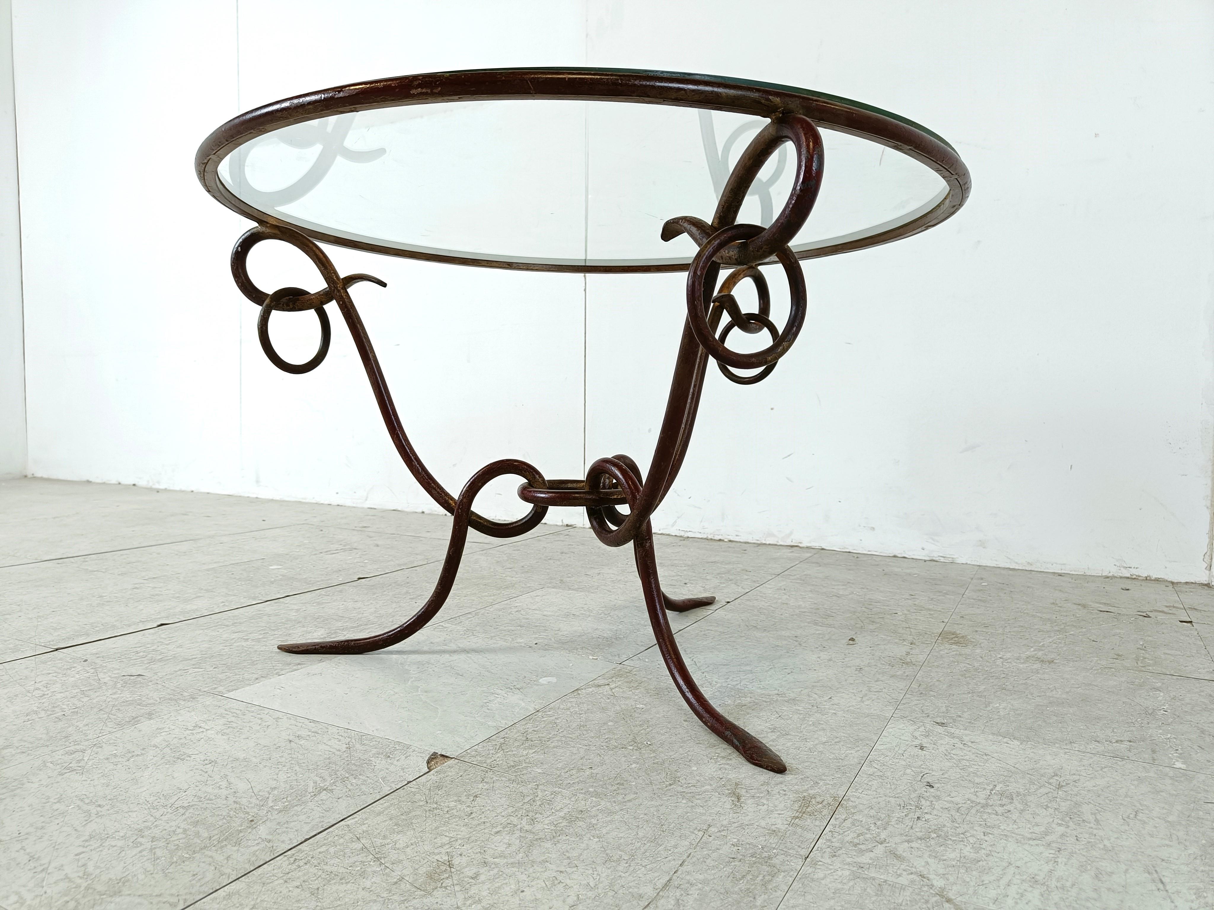 Glass Wrought iron coffee table by René Drouet