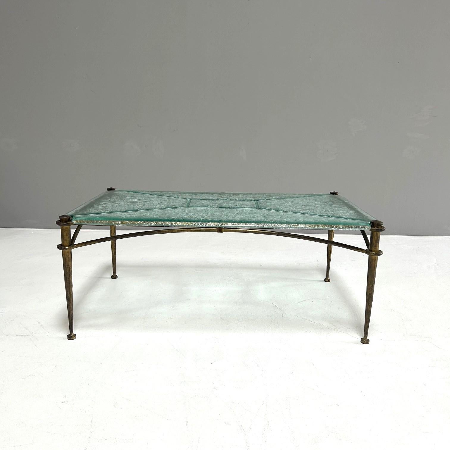 Coffee table in artfully forged iron with a bronze patina.
Glass top specially cast and machined for this table.