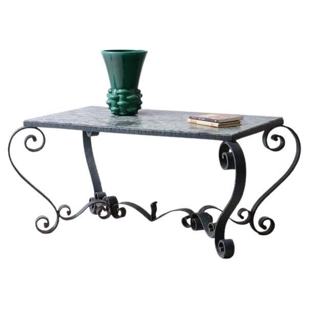 Wrought iron coffee table with a green marble For Sale