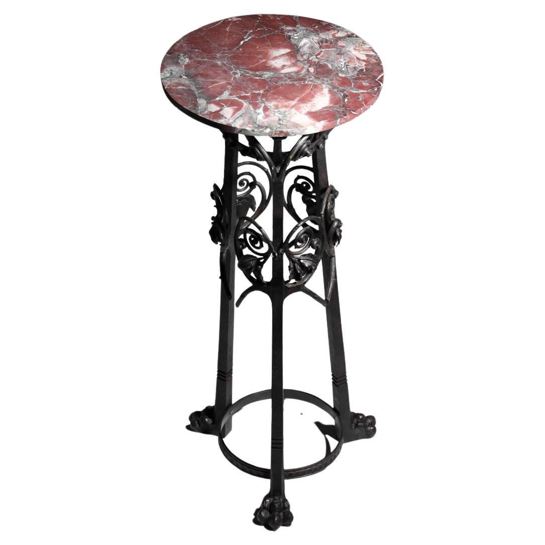 Wrought iron column stand with art nouveau foliage decoration For Sale
