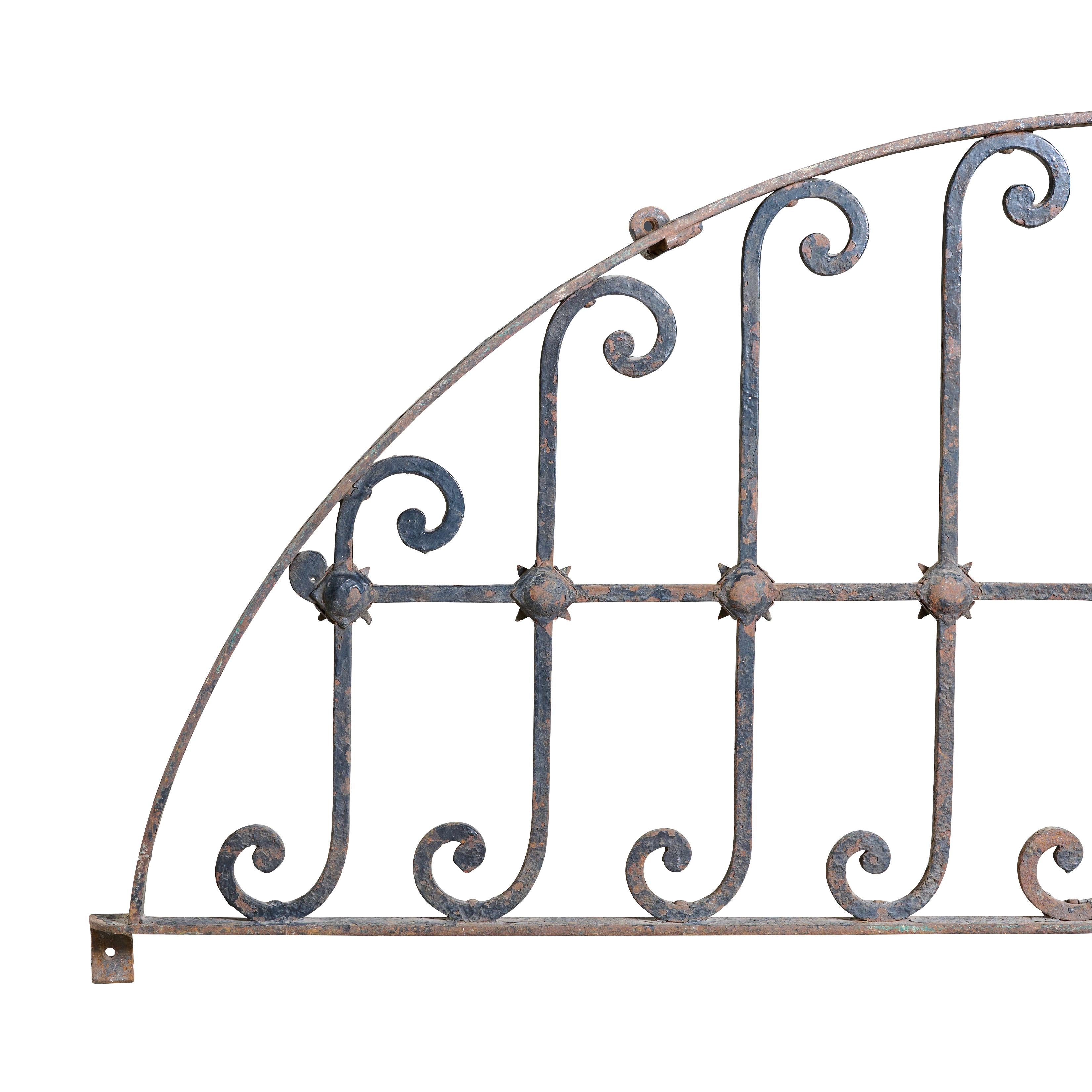 Wrought iron decorative arched grill. With cool design.

