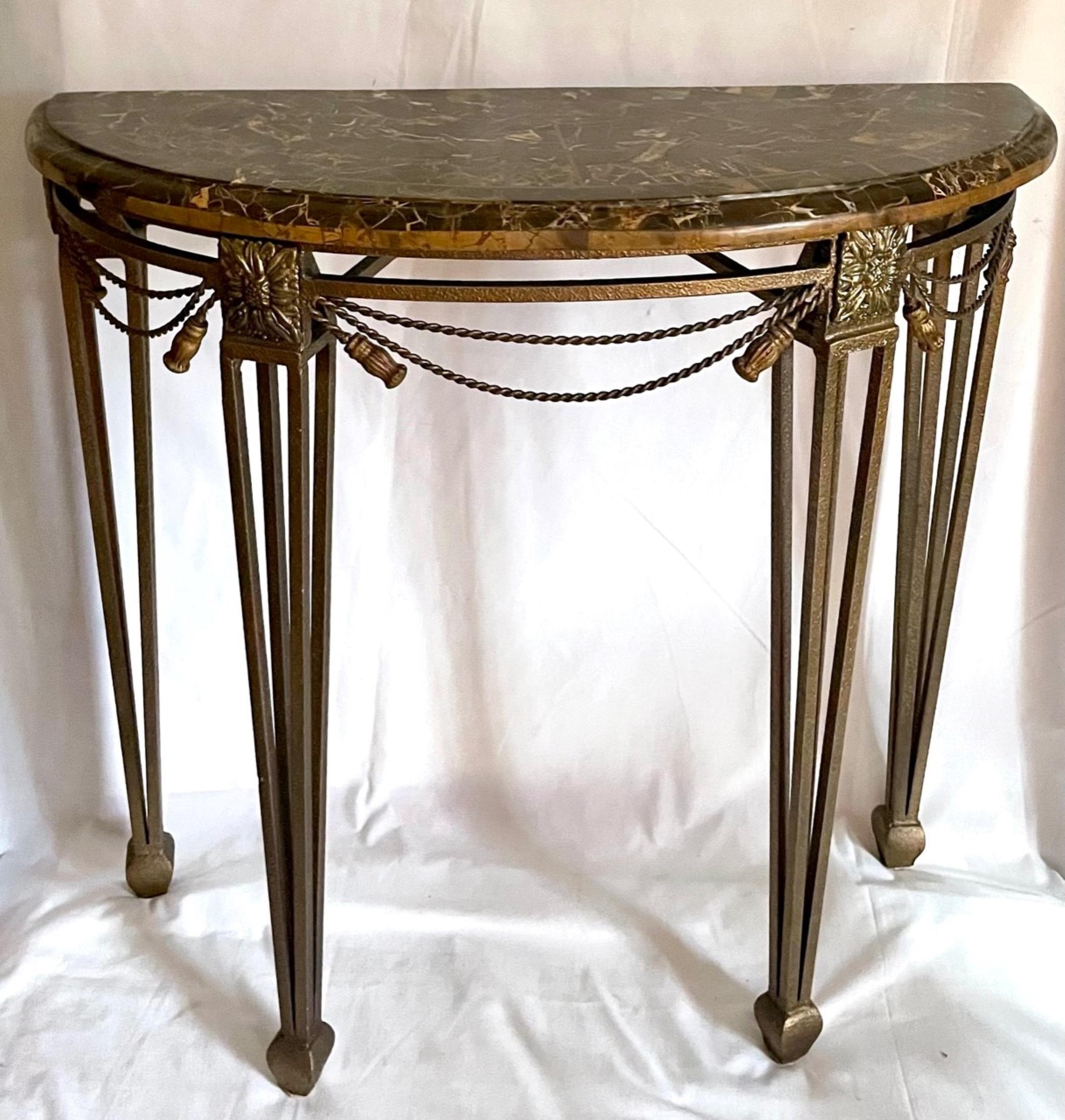 Wrought iron Demilune marble top console table after Oscar Bach

Art Deco style high quality heavy wrought iron demilune marble top
console table after Oscar Bach. The decorative console with elegant lines, features a hammered bronze