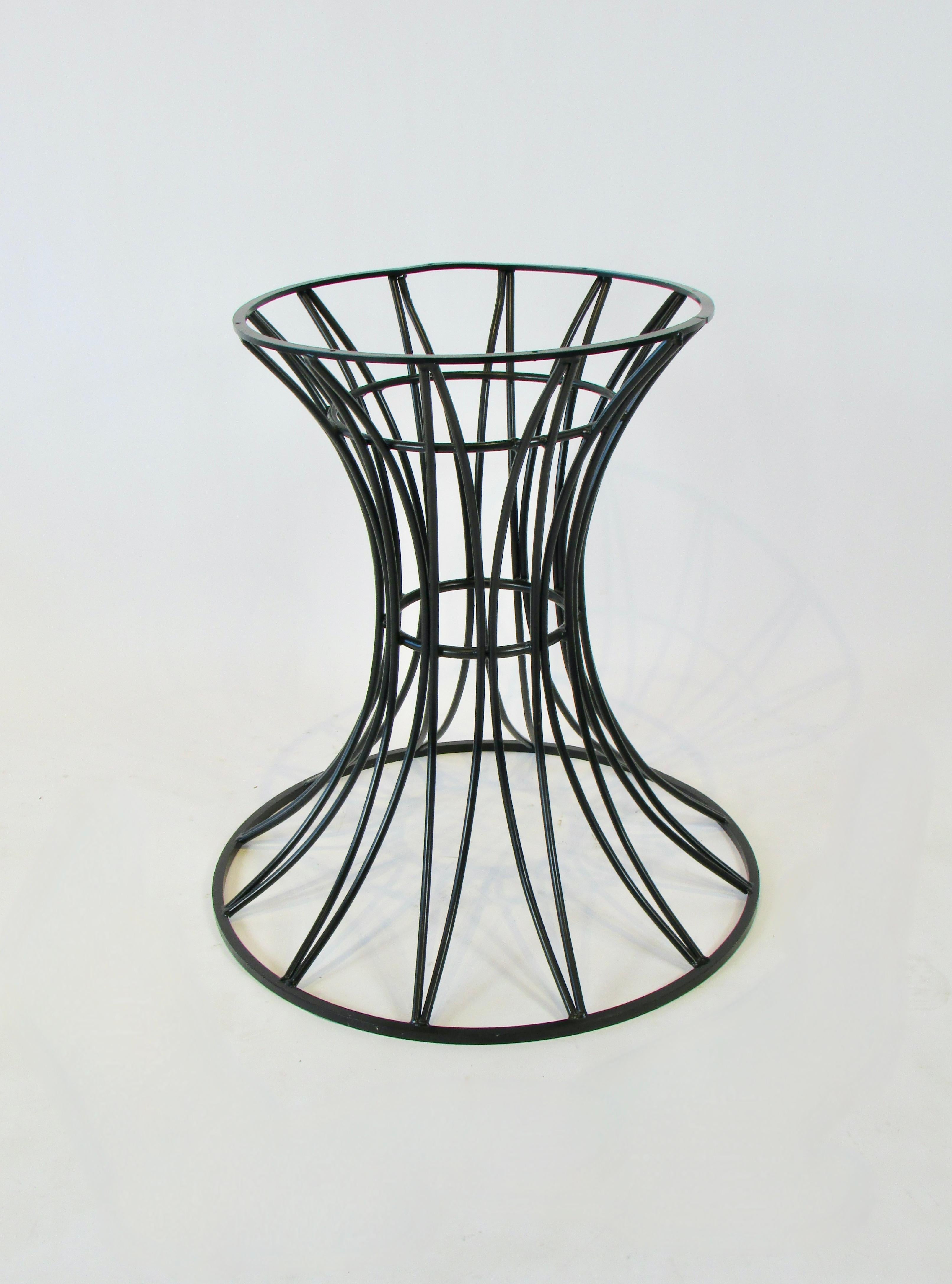 Hour glass form dining table base . round steel rods curve up from 25.5 
' diameter base to more narrow 19