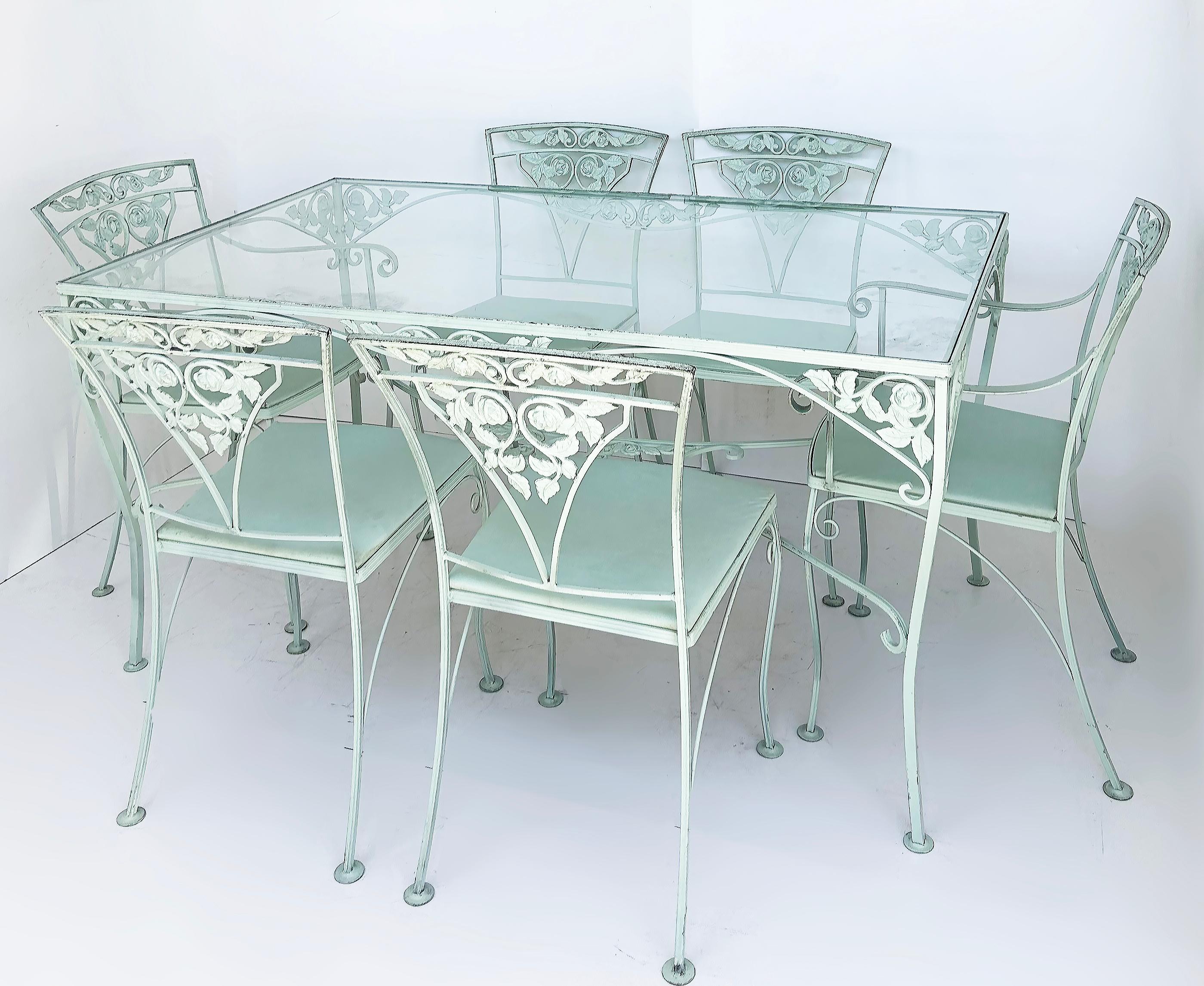 Wrought Iron Dining Table Set of 6 Chairs, Russell Woodard attributed

Offered for sale is a mid-century modern wrought iron 7-piece set with a dining table and chairs attributed to Russell Woodard. The chairs each have their upholstered seats. 