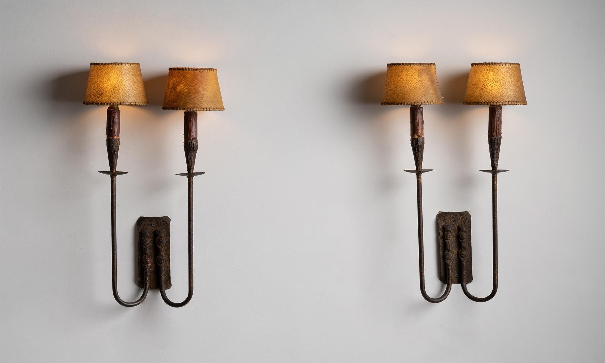 Wrought iron double sconces, Spain Circa 1950

Wrought iron candelabra with oxblood red candle wax and natural parchment shades.

Ref. L4409

*Please note that items are sold individually and are priced per item*