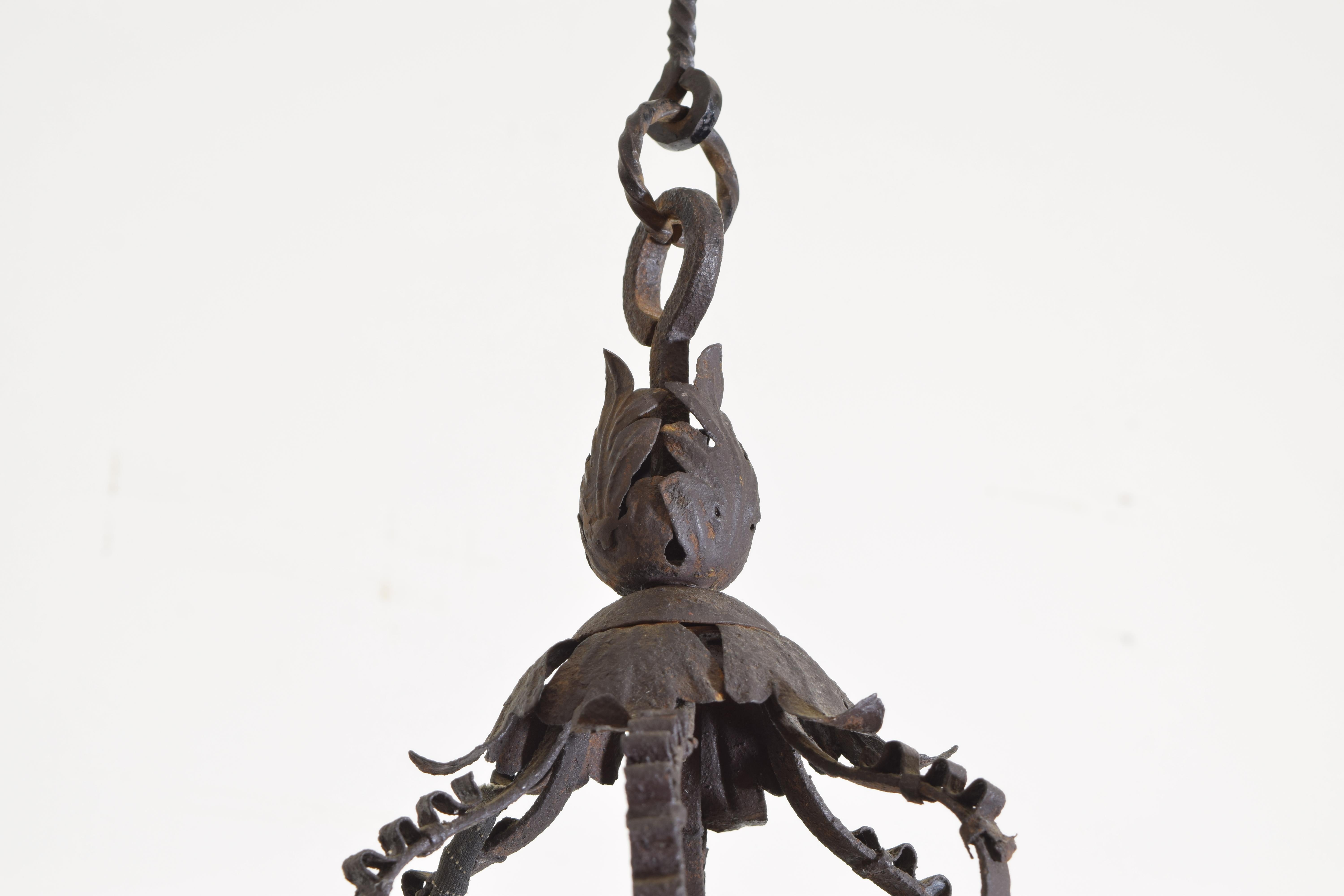 Wrought Iron Filigree Baroque Style Hanging Glass Paned Lantern, 19th century In Good Condition In Atlanta, GA